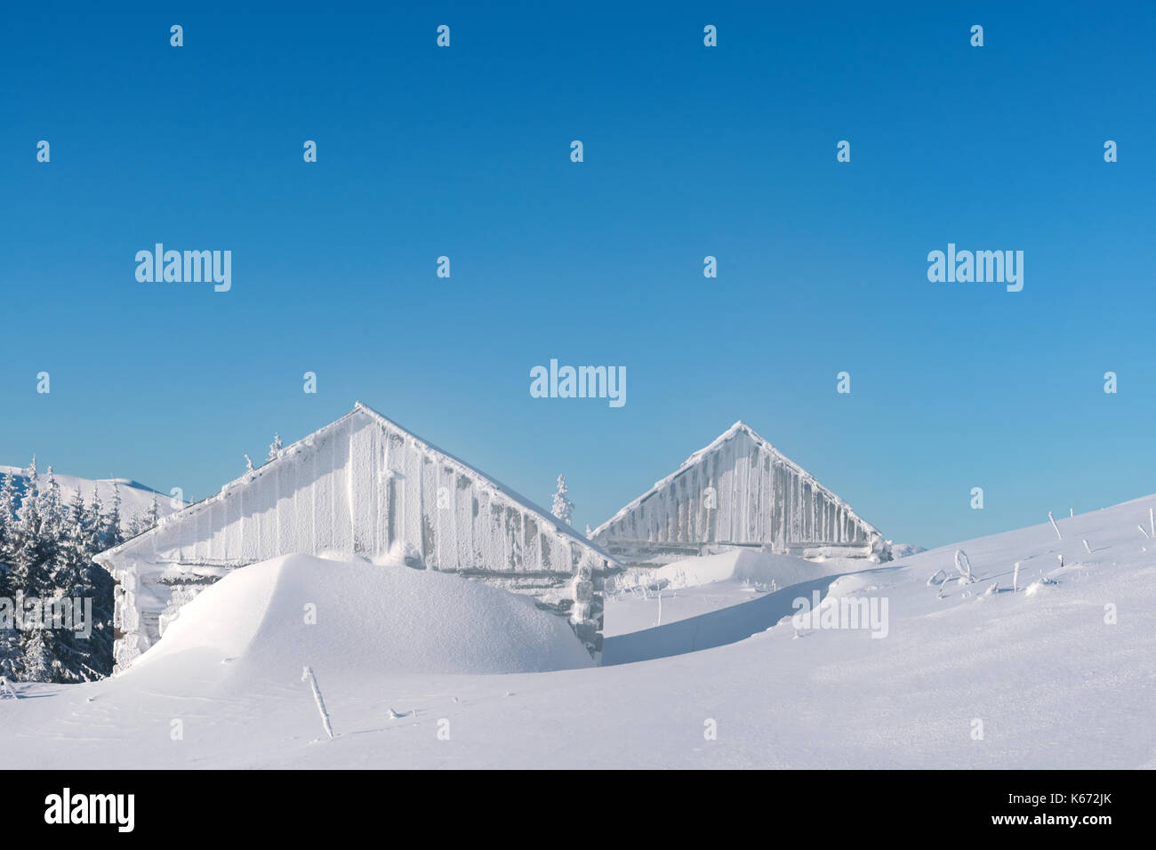 Snowy cabin in the winter mountains Stock Photo