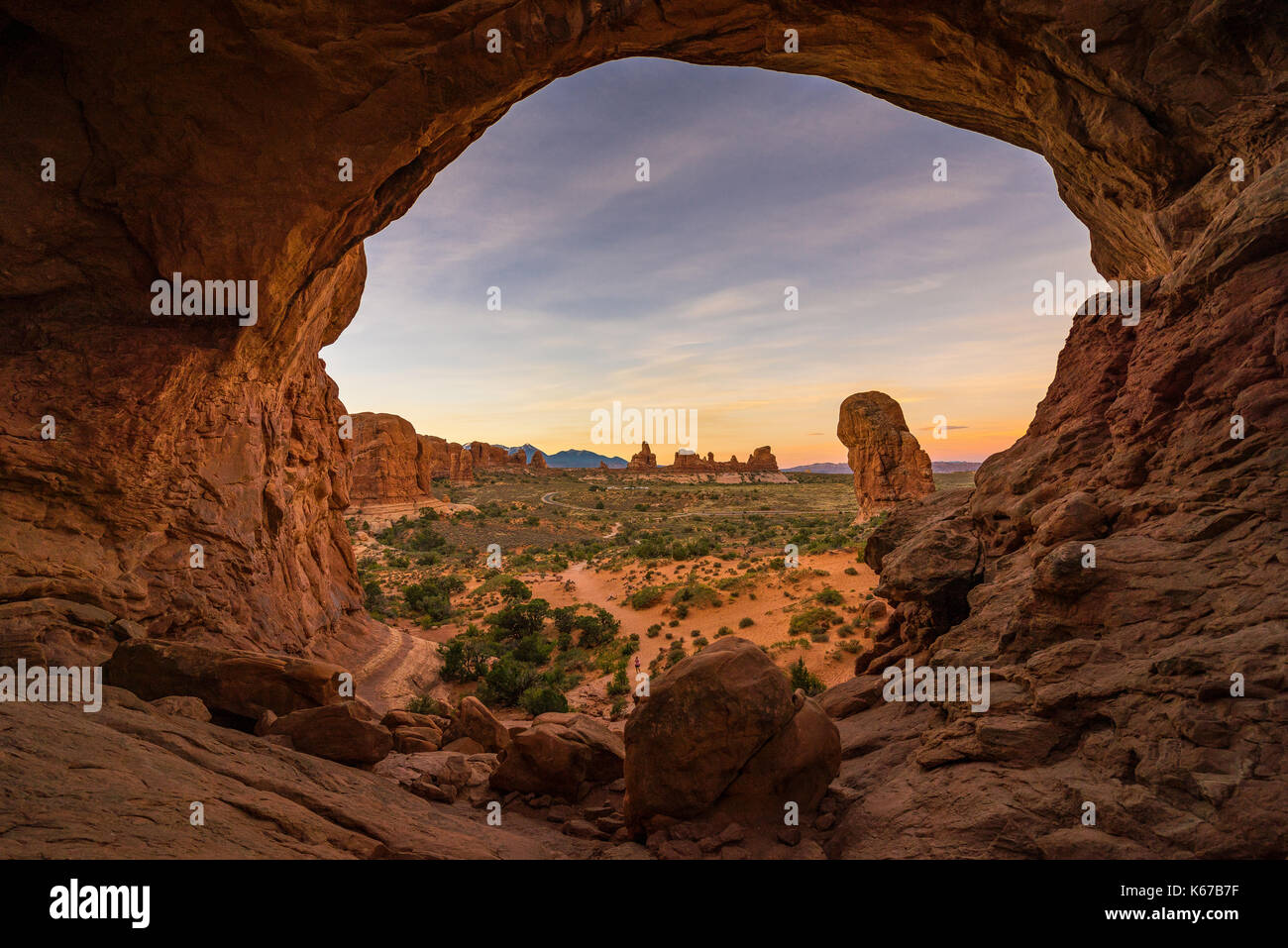 View through Double Arch, Parade of Elephants Trail, Arches National Park, Utah, United States Stock Photo