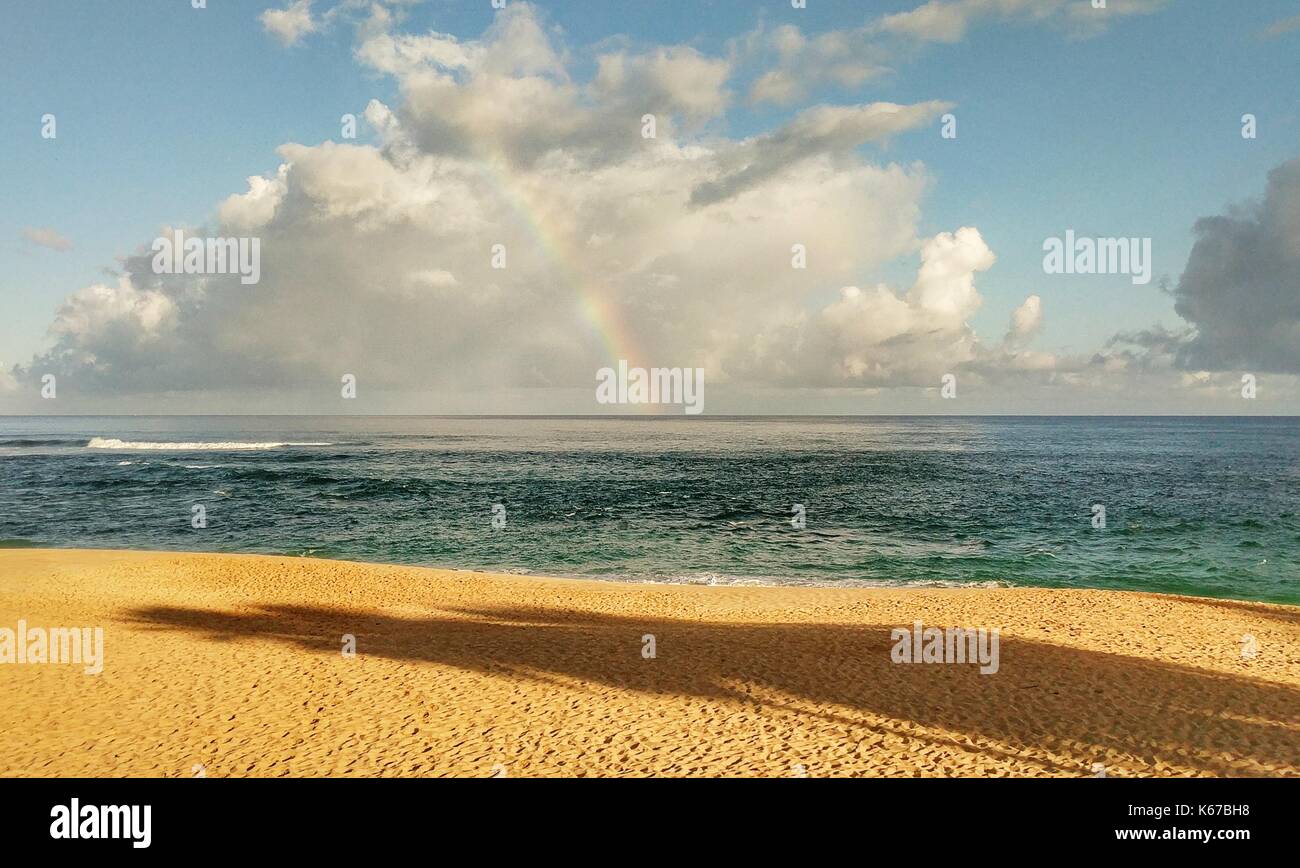 Rainbow over the horizon, North Shore, Oahu, Hawaii, United States Stock Photo