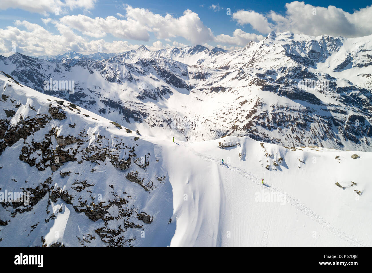 Aerial image of a group of 3 people ski touring Stock Photo