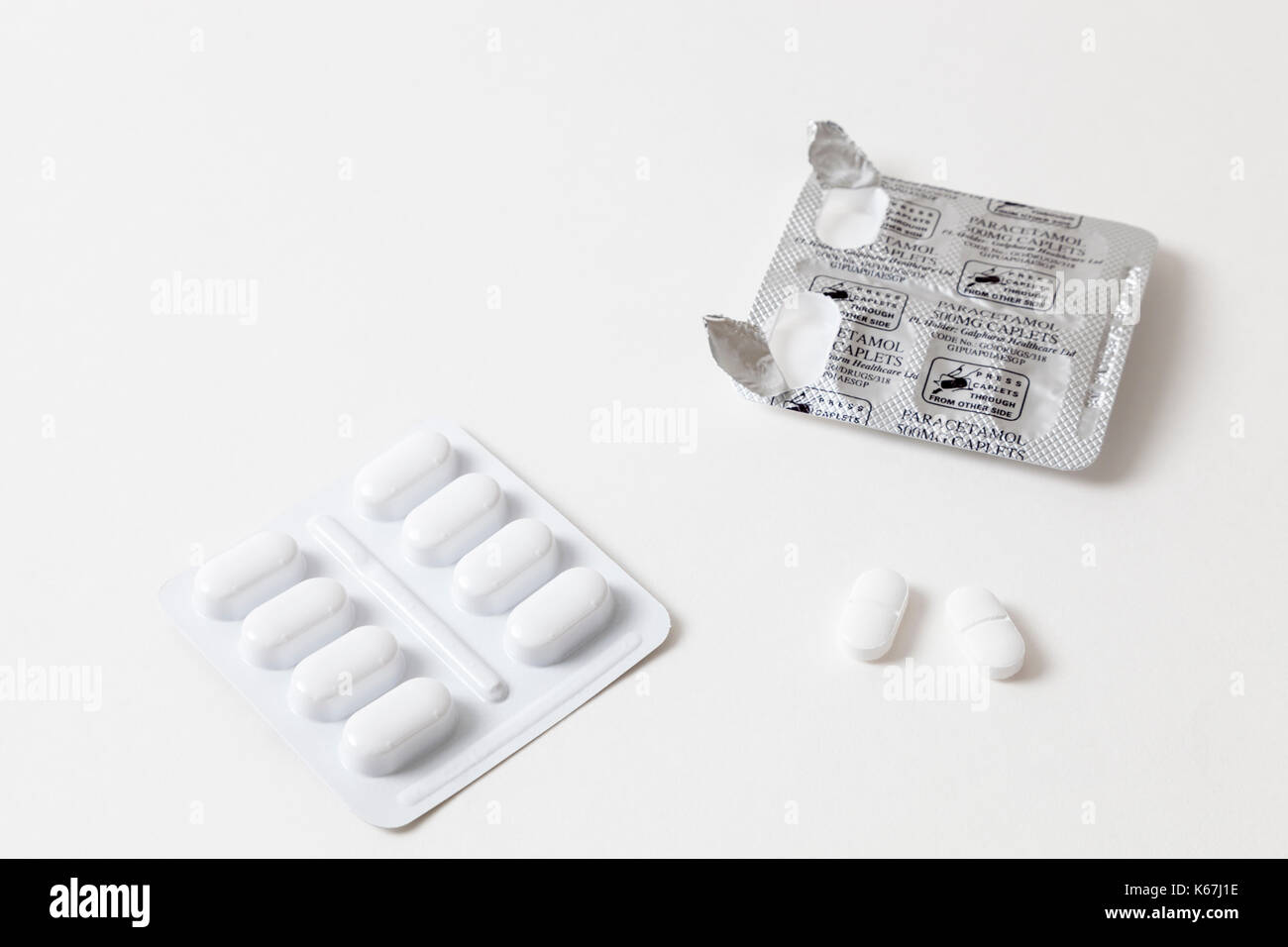 Pain killers: open blister pack of paracetamol pills or tablets with two paracetamol 500 mg caplets removed. Stock Photo