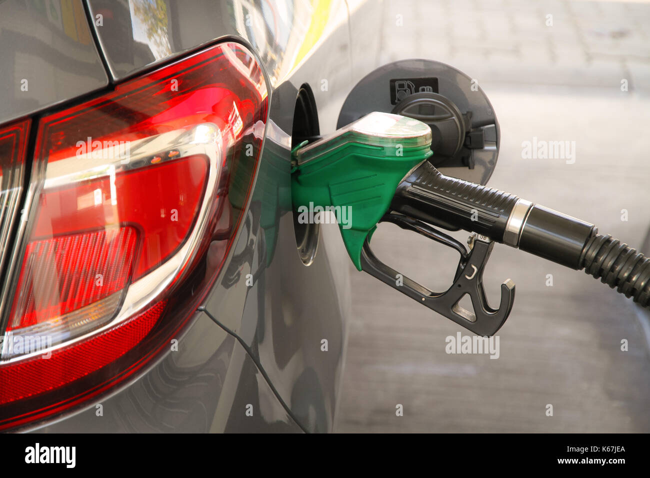 Car refueling at the petrol station. Concept for use of fossil fuels