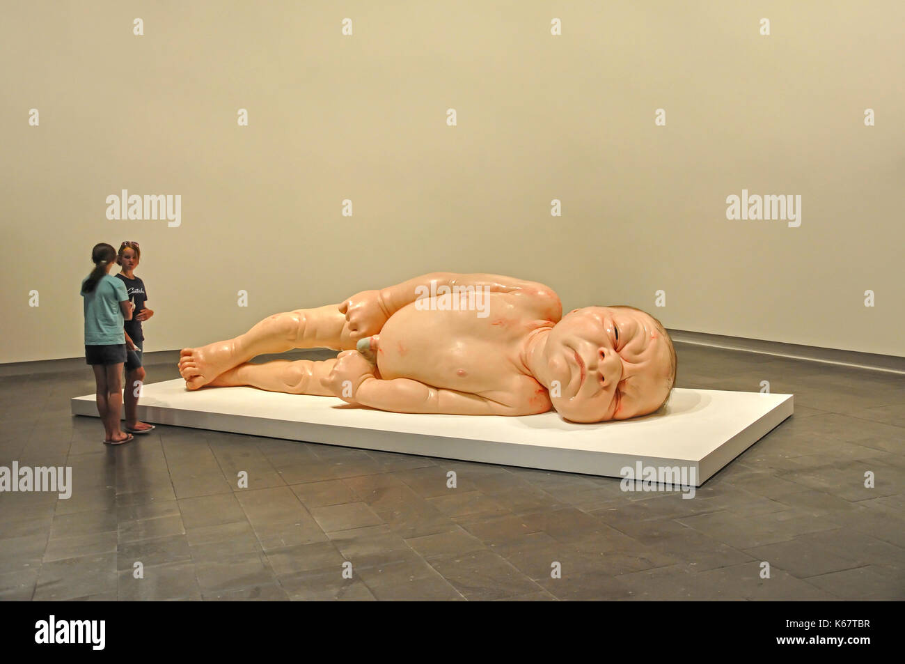 'Newborn baby' sculpture at Ron Mueck Exhibition, Christchurch Art Gallery, Christchurch, Canterbury, South Island, New Zealand Stock Photo
