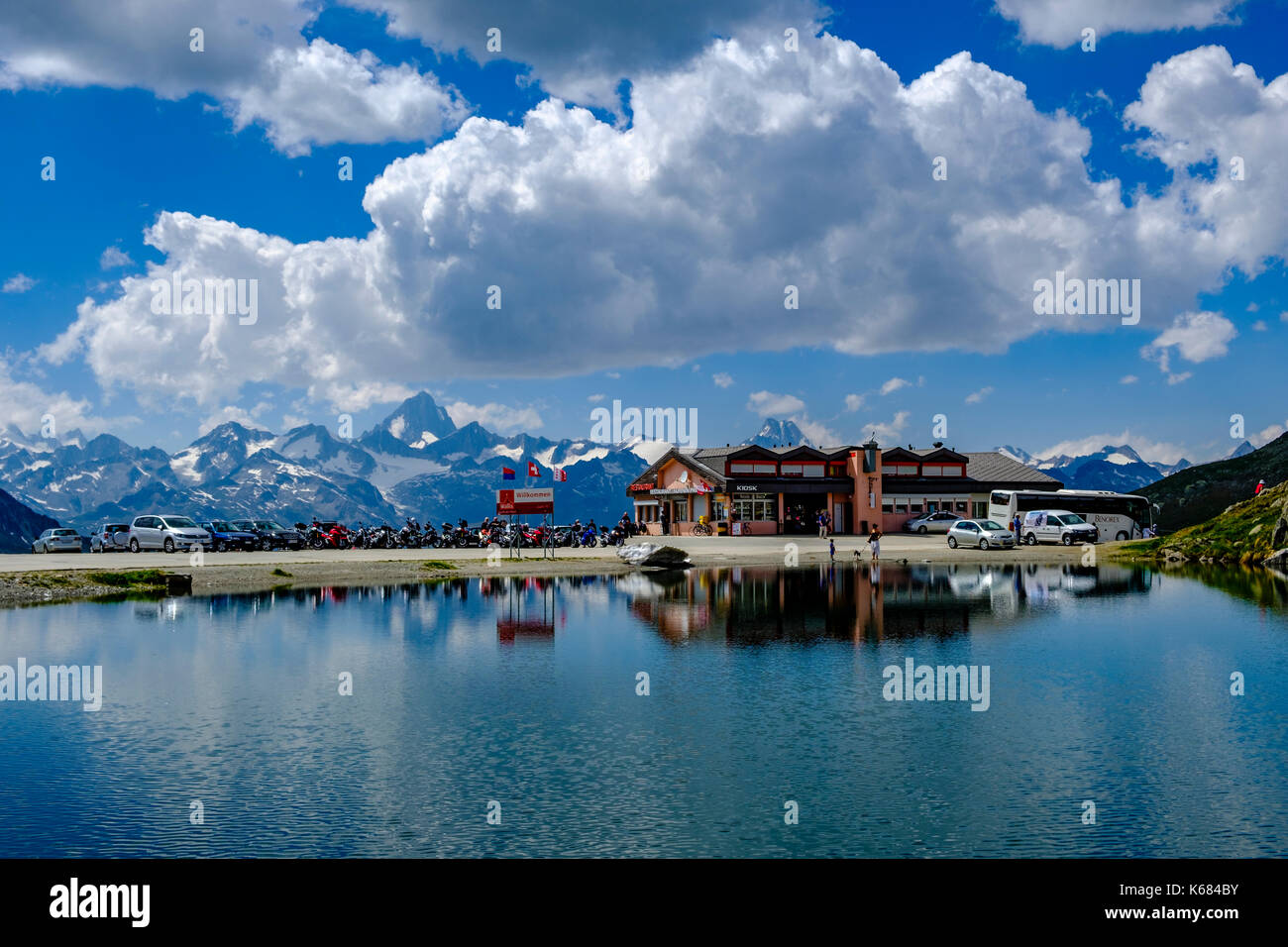 Landscape with the alpine hut and a lake on top of Nufenen Pass Stock Photo