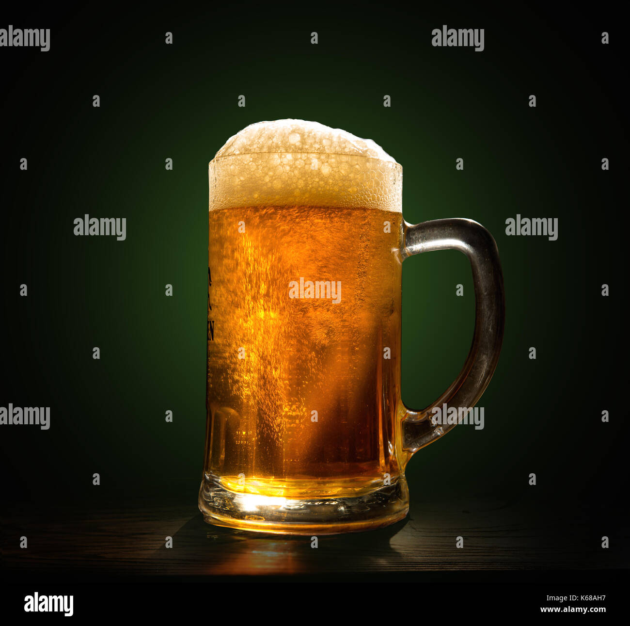 A glass of fresh, cold beer close-up on a black background Stock Photo