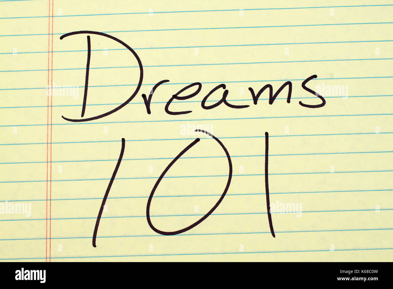 The words 'Dreams 101' on a yellow legal pad Stock Photo