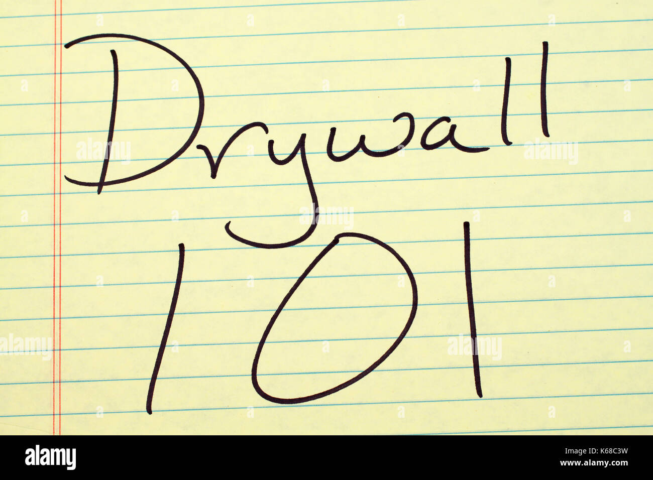 The words "Drywall 101" on a yellow legal pad Stock Photo Alamy