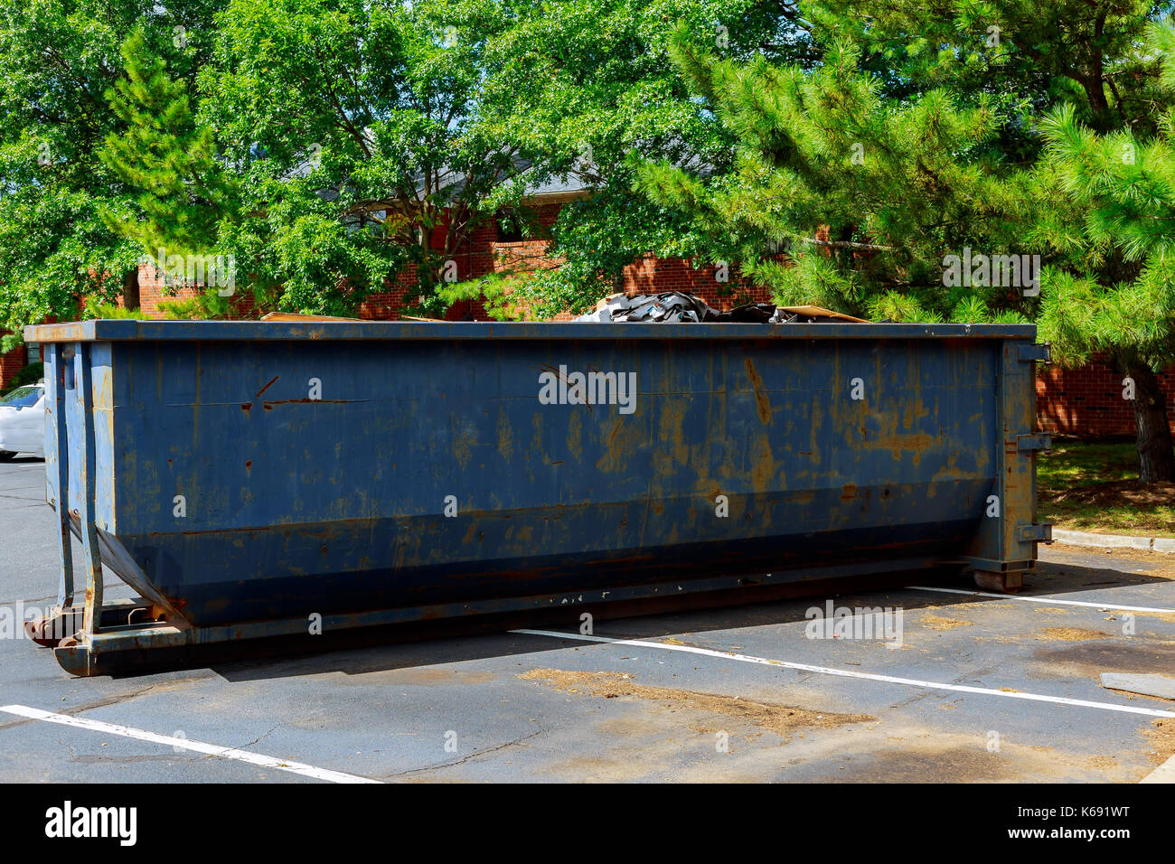 Dumpsters being full with garbage in a city. Dumpsters being full with