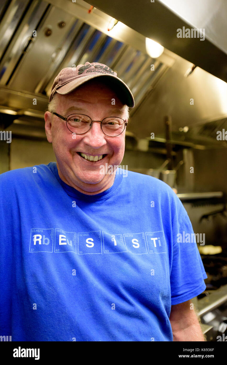 Award winning chef, food writer, + cookbook author Bill Smith in the kitchen of his Crook's Corner Restaurant in Chapel Hill, North Carolina Stock Photo
