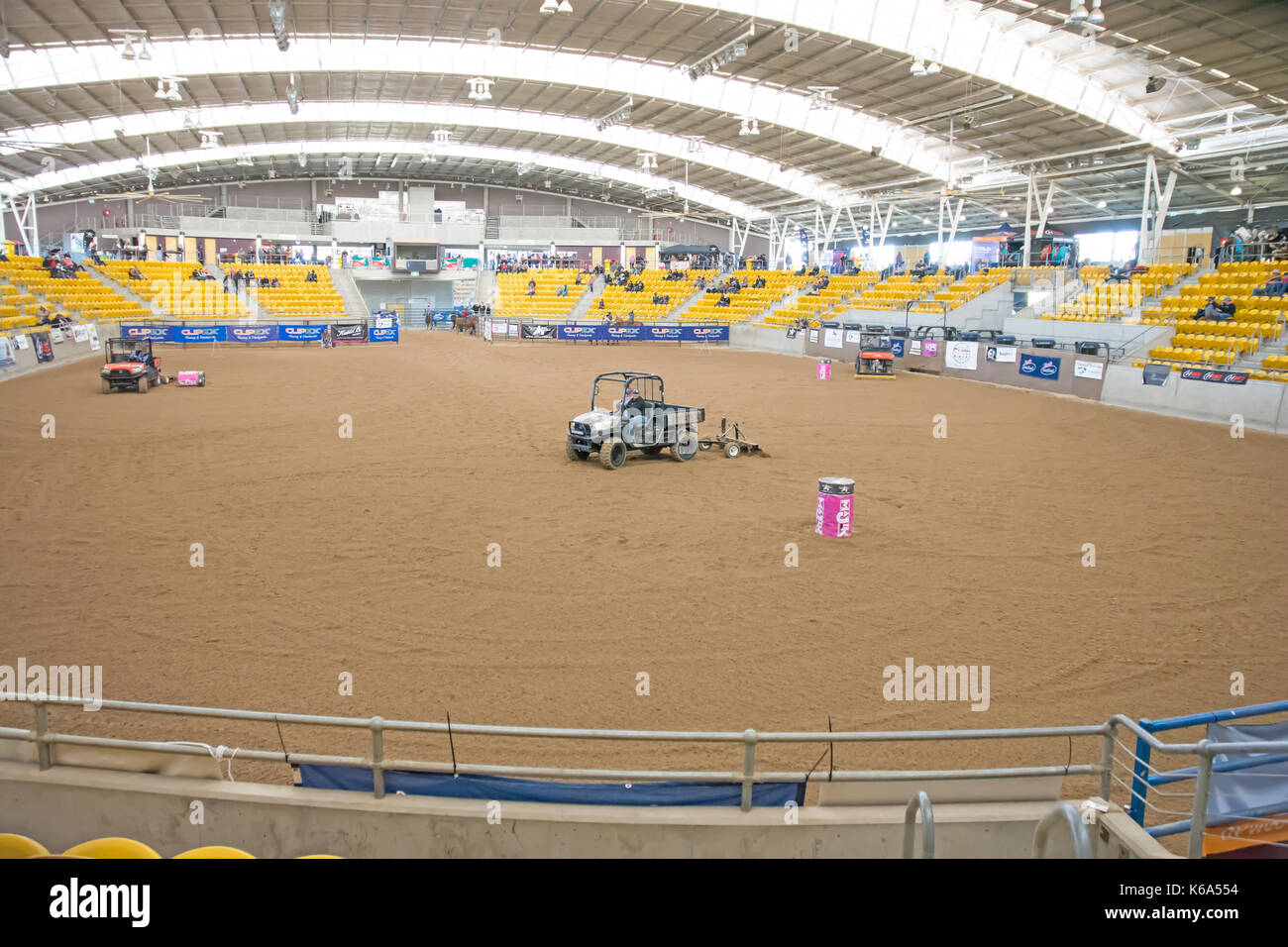 Golf Buggies raking and smoothing sand at he indoor arena at Australian