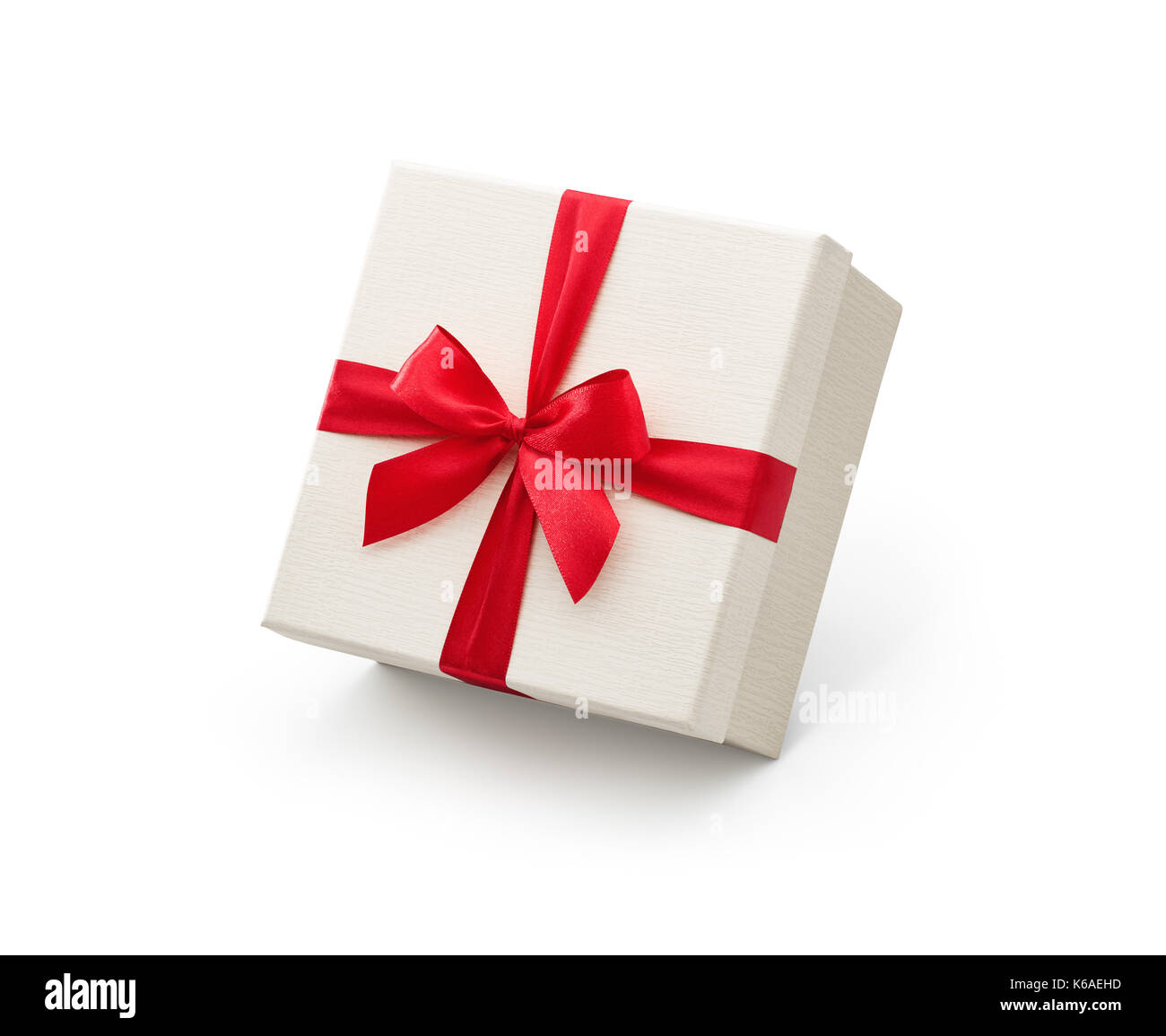 White gift box with red bow isolated on white background - Clipping path included Stock Photo