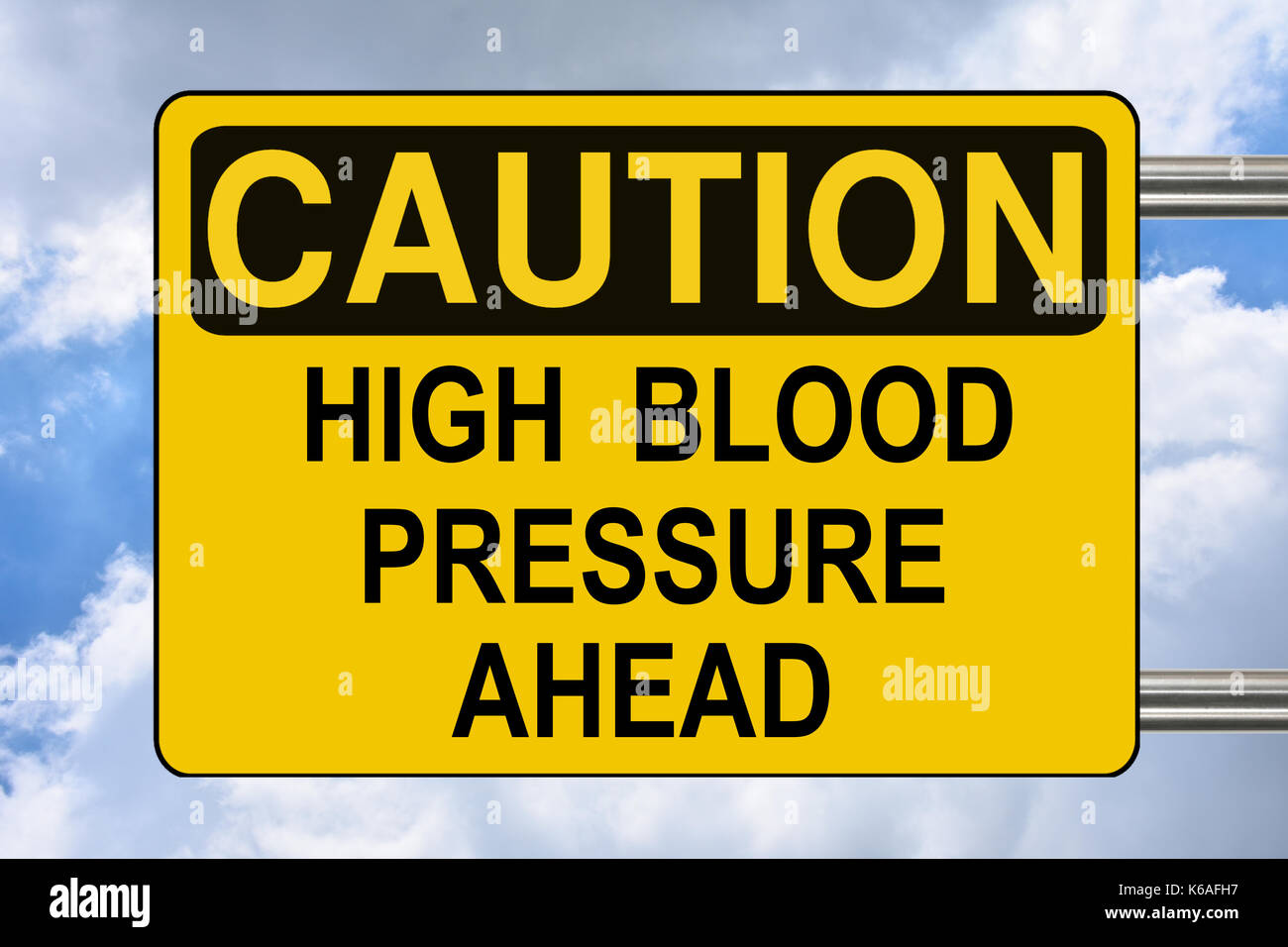 High blood pressure ahead, caution yellow road sign Stock Photo - Alamy