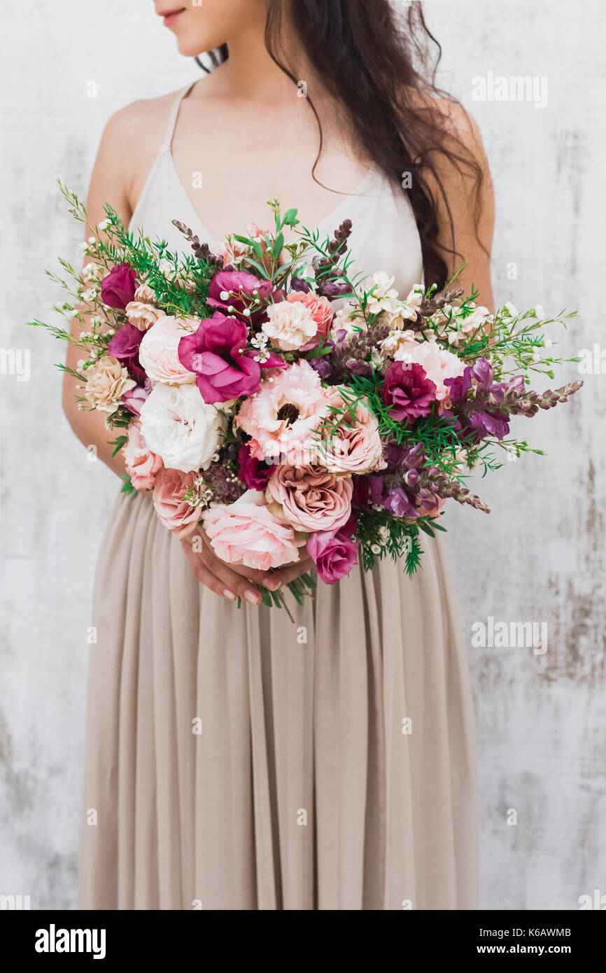 Сhic wedding bouquet of peonies and roses in hands of the bride Stock ...
