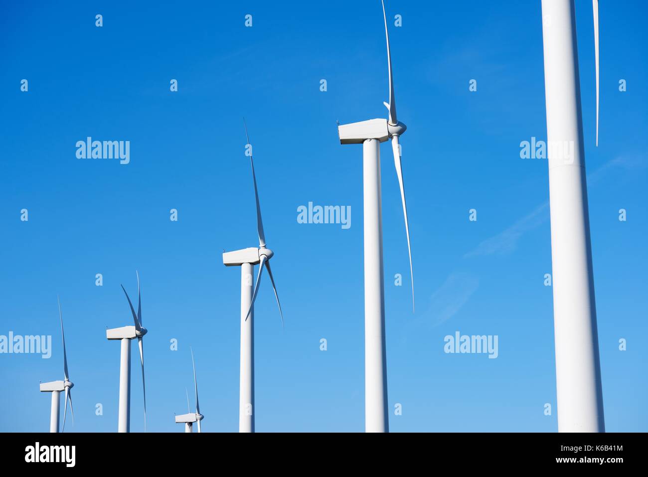 windmills for  electric power production and blue sky, El Buste, Zaragoza, Aragon, Spain Stock Photo