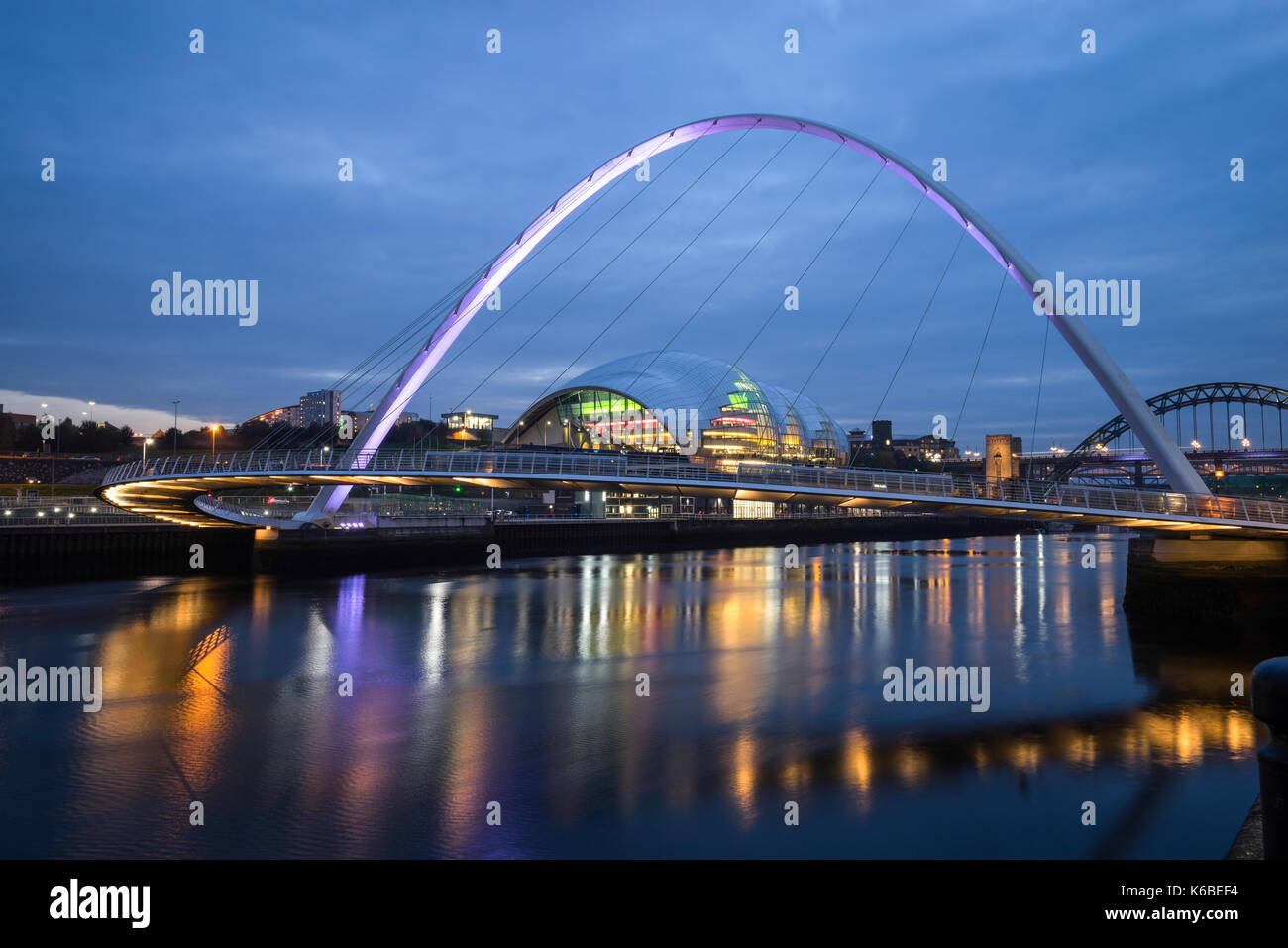 The Newcaste-Upon-Tyne/Gateshead quayside at dusk, showing the Sage, Milennium and Tyne bridges Stock Photo