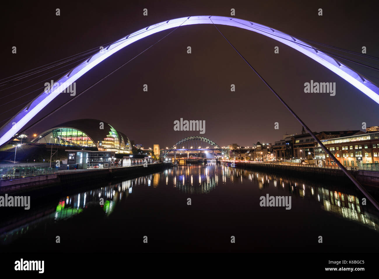 The Newcaste-Upon-Tyne/Gateshead quayside at night, showing the Sage, Milennium and Tyne bridges Stock Photo