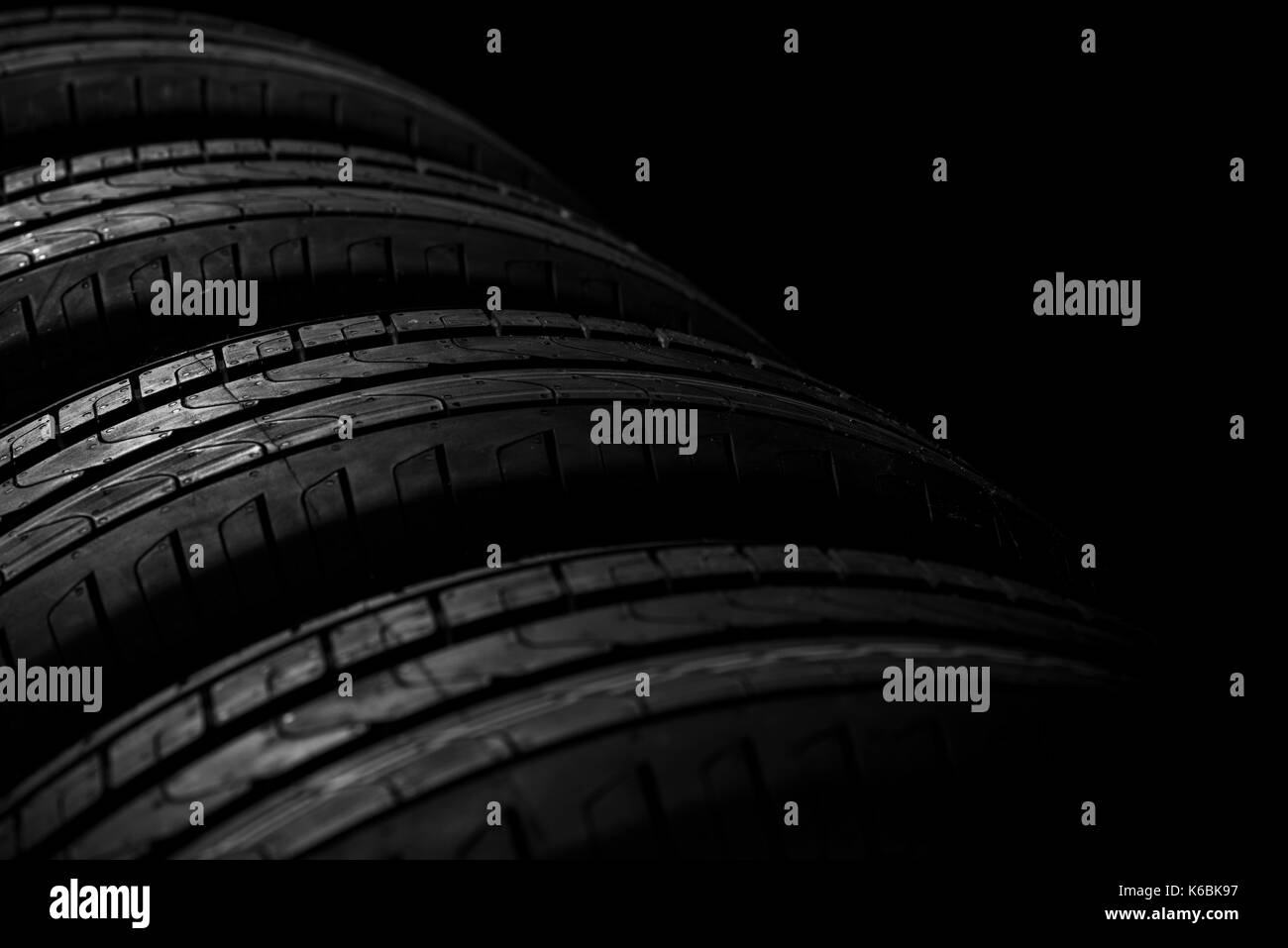 Tire stack on background. Selective focus.Wheel Pattern Stock Photo