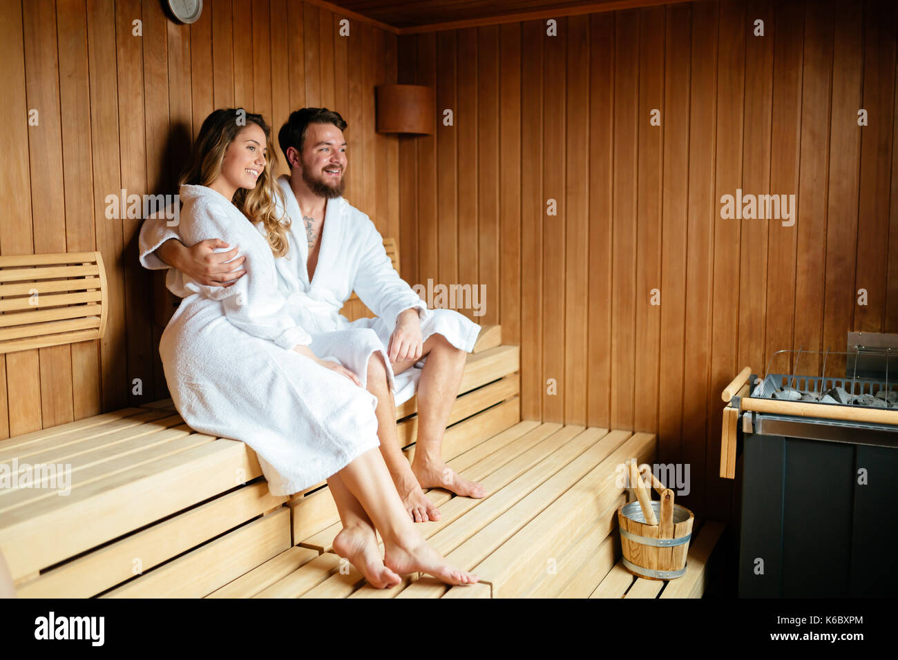 Beautiful couple relaxing in sauna Stock Photo - Alamy
