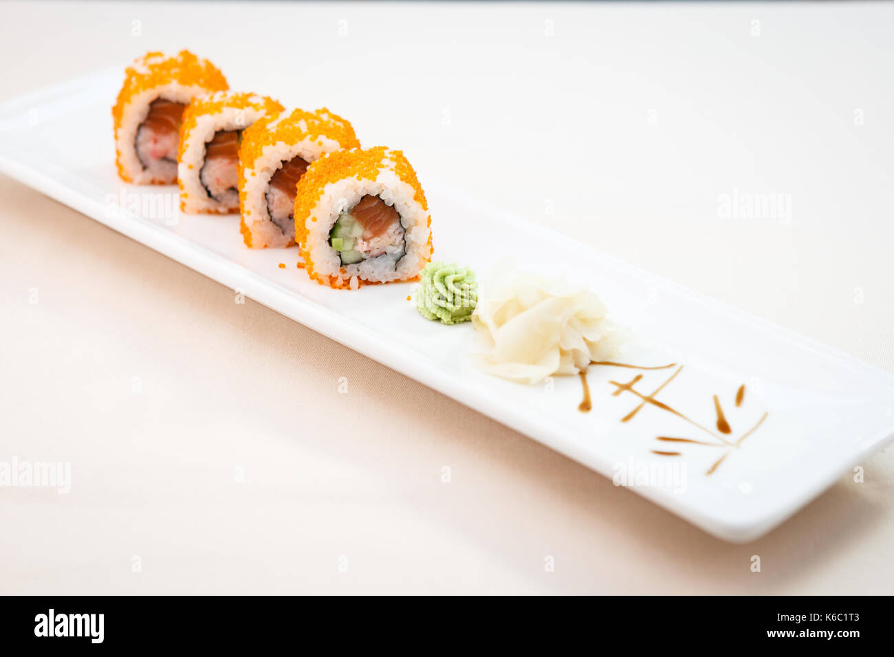 Flying fish roe maki Stock Photo - Alamy