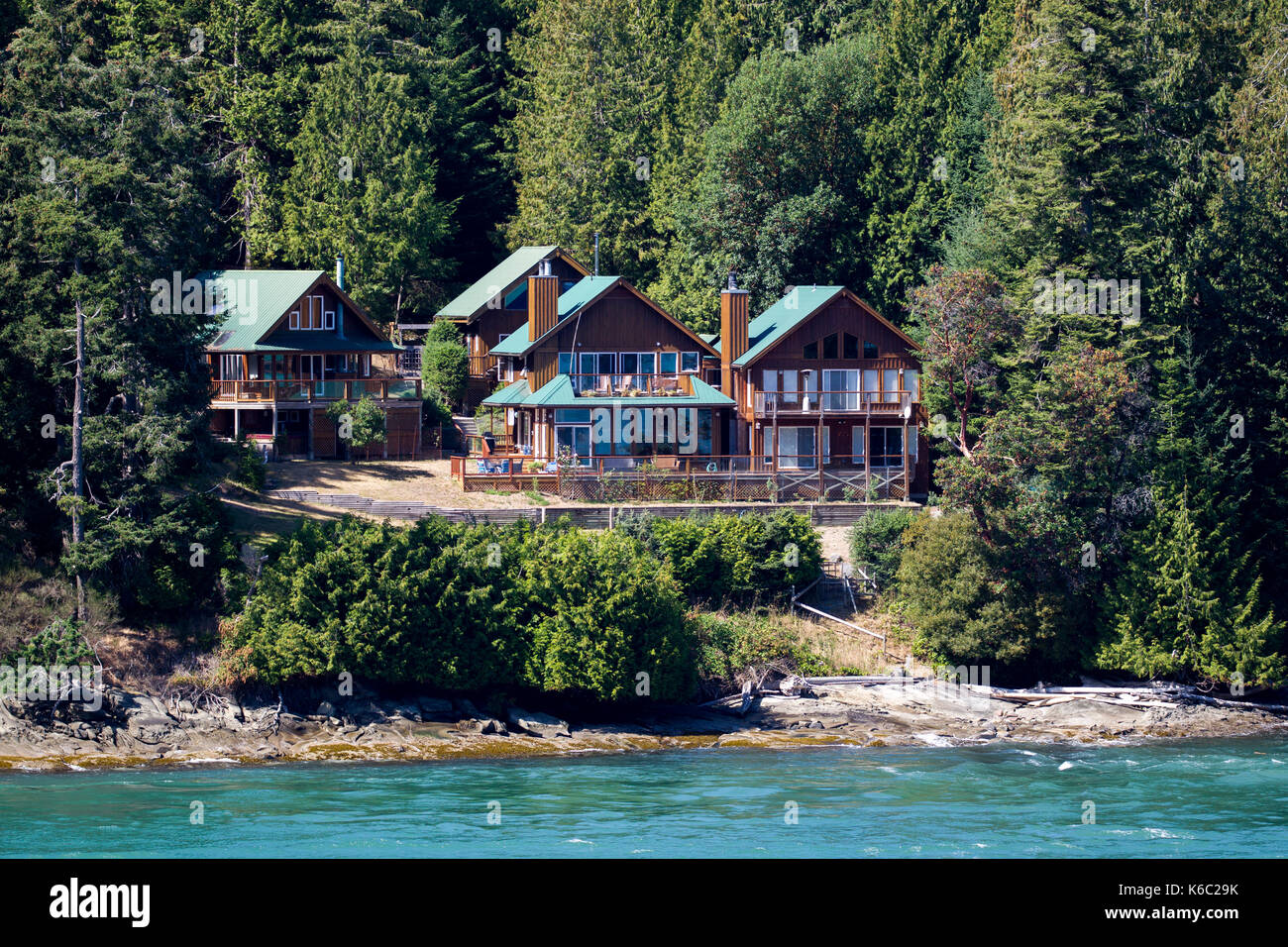 Houses at the coast of the Gulf Islands at Vancouver Island, British Columbia, Canada. Stock Photo