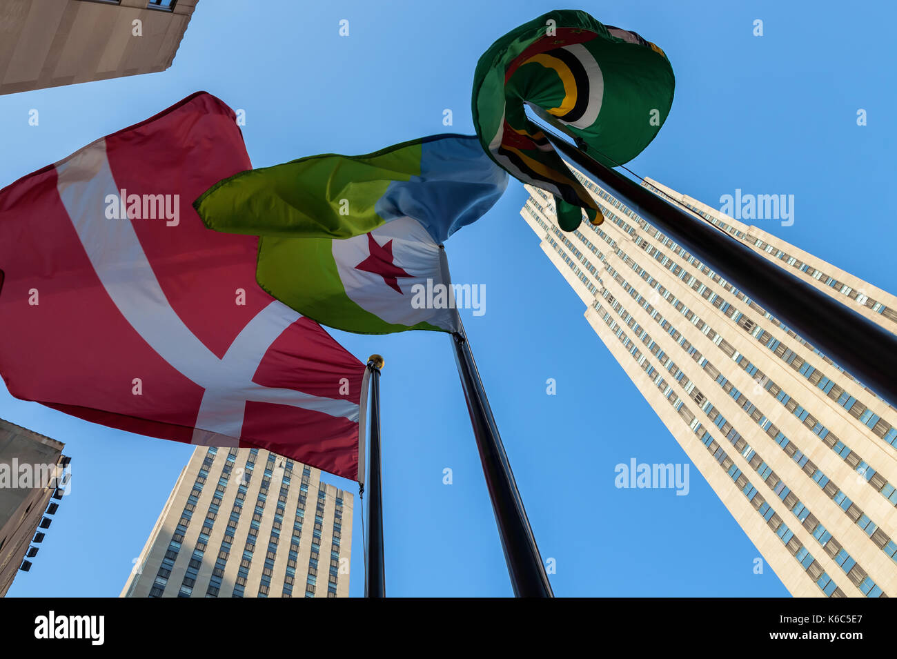The flag of Denmark and Djibouti fly at the Rockefeller Center in New York City, New York. Stock Photo
