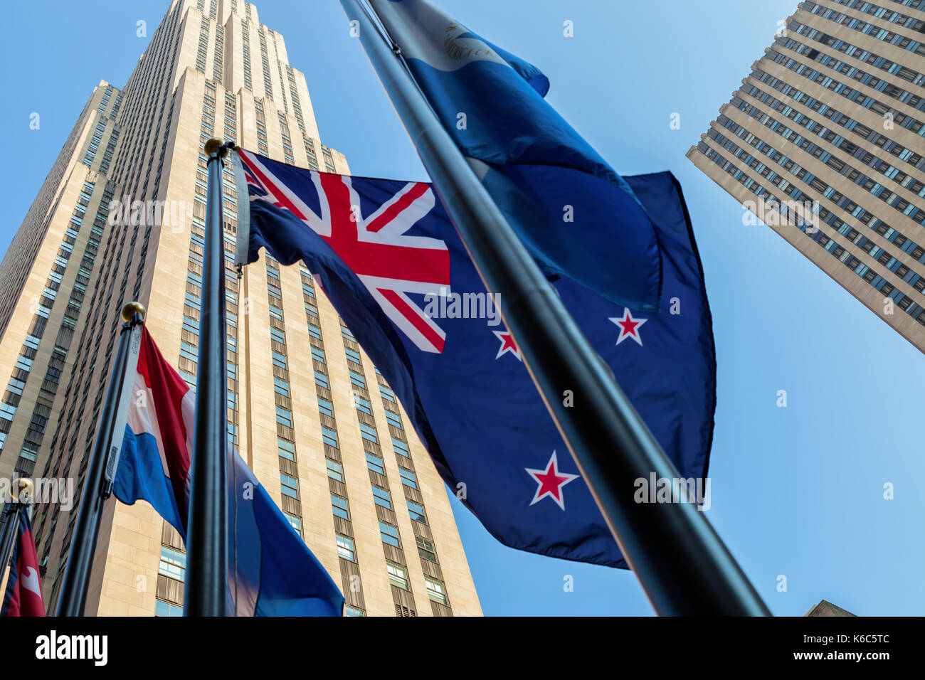 A  New Zealander Flag flies at the Rockefeller Center with the Rockefeller Building in the background, New York City, New York Stock Photo