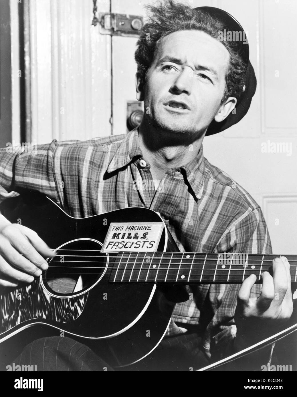 WOODY GUTHRIE (1912-1967) American folk musician in 1943 Stock Photo