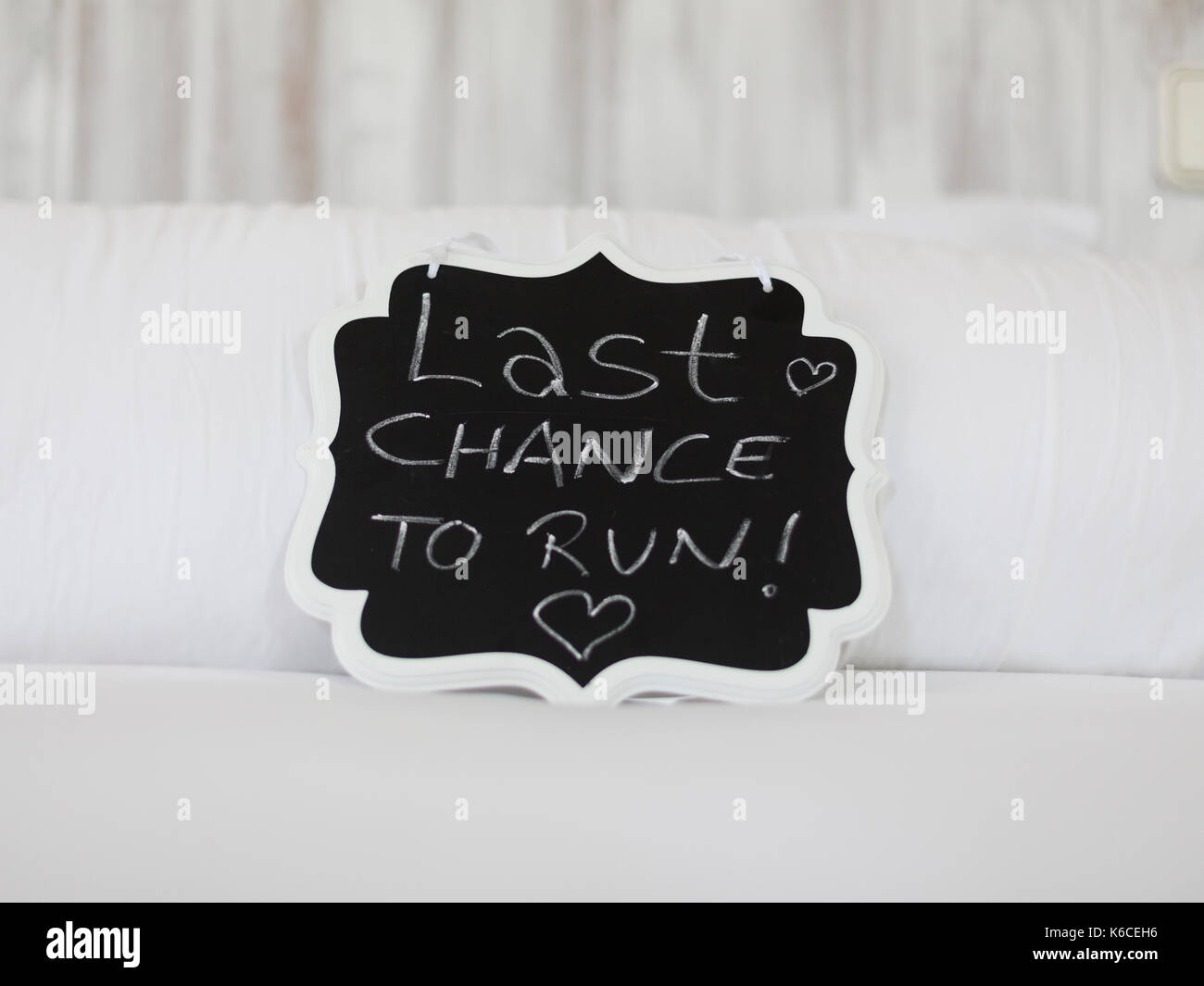 Blackboard with funny phrase for wedding 'last chance to run' Stock Photo