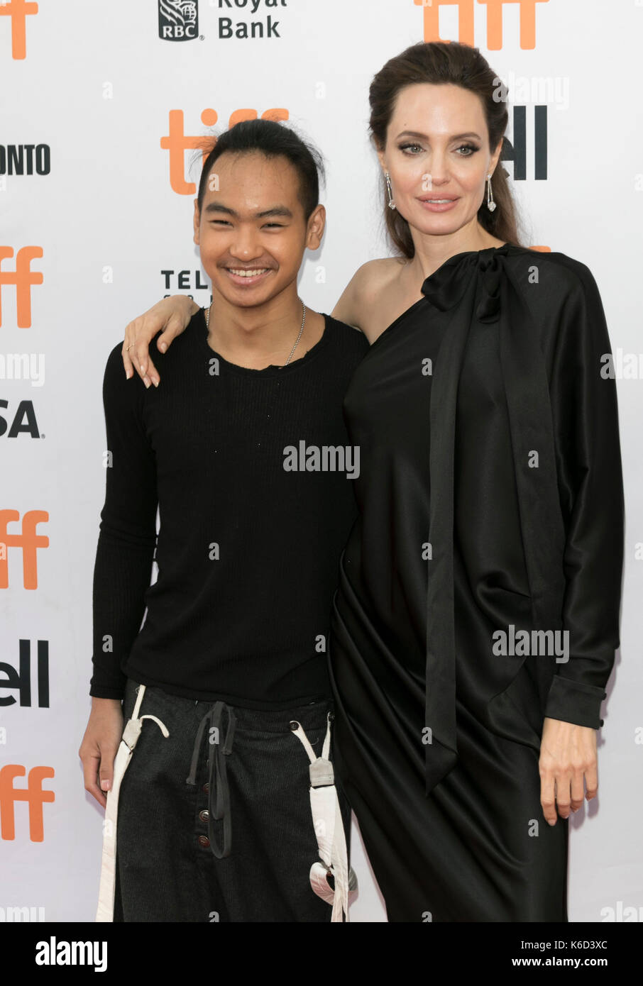 Toronto, Canada. 11th Sep, 2017. Pax Thien Jolie-Pitt (l) and Angelina Jolie attend the premiere of 'First They Killed My Father' during the 42nd Toronto International Film Festival, tiff, at Princess of Wales Theatre in Toronto, Canada, on 11 September 2017. · NO WIRE SERVICE · Photo: Hubert Boesl/dpa/Alamy Live News Stock Photo