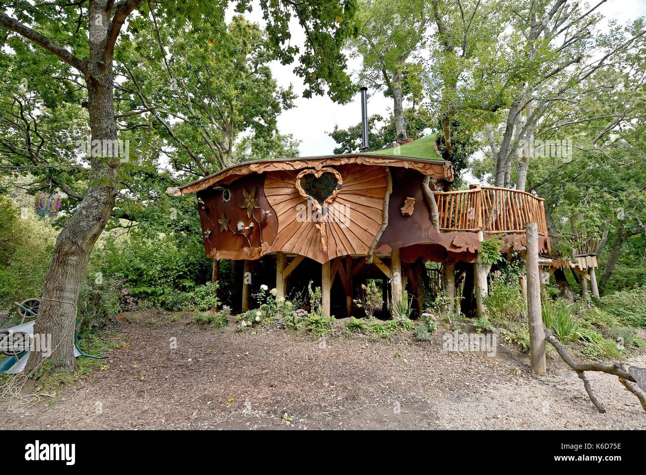 Ditchling Sussex, UK. 12th Sep, 2017. A new tree house has been unveiled at Blackberry Wood campsite near Ditchling in Sussex . The new upmarket tree house called Piggledy has been built by campsite owner Tim Johnson and is larger than the original next door tree house called Higgledy . The quirky campsite is well known for having a London bus and an old Wessex helicopter where people can also stay in peaceful surroundings nestled just north of the South Downs National Park Credit: Simon Dack/Alamy Live News Stock Photo