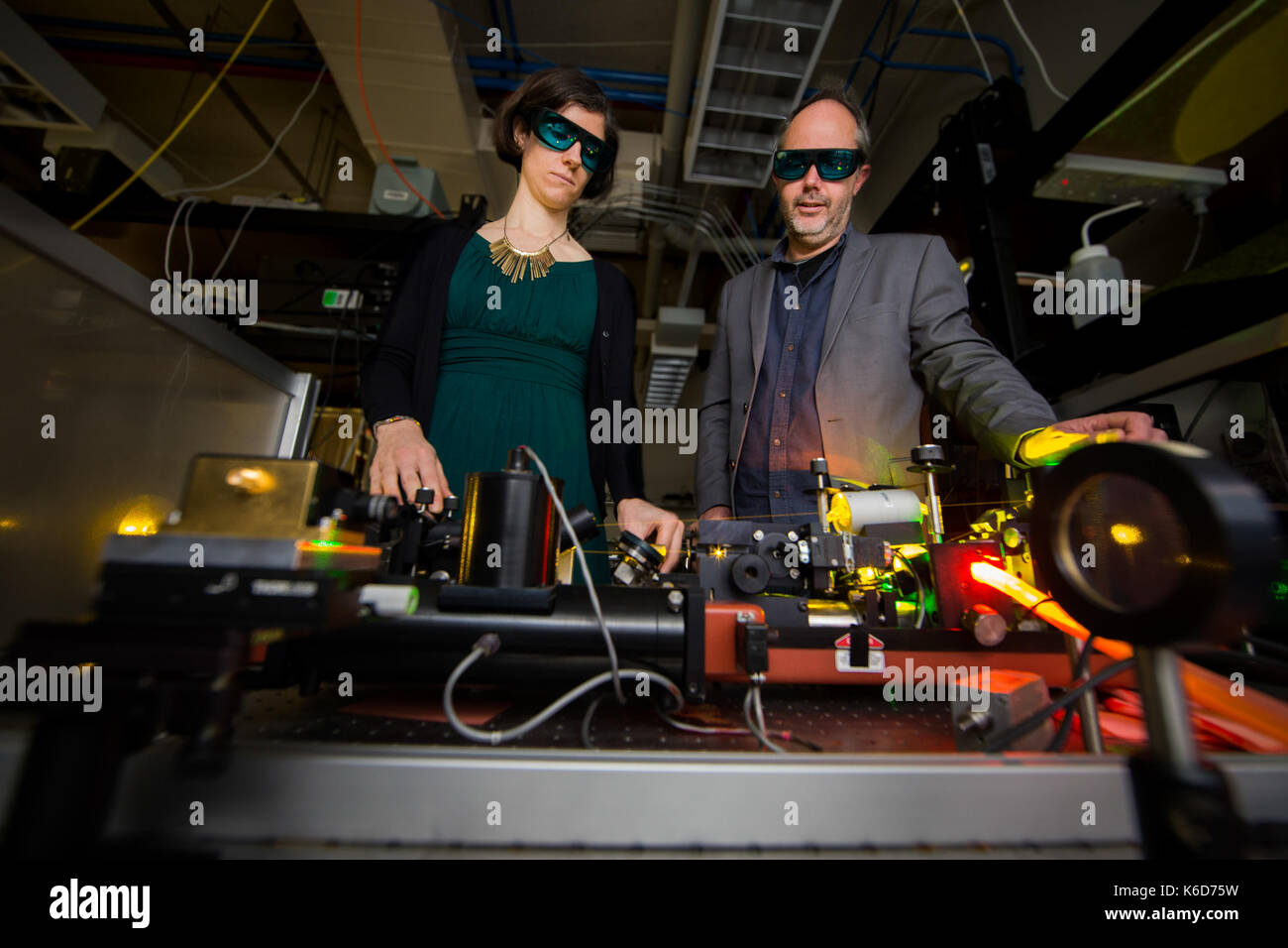 Canberra, Canberra. 6th Sep, 2017. Doctor Rose Ahlefeldt (L) and Associate Professor Matthew Sellars operate a high resolution dye laser, which they use to study rare earth crystals in the Australian National University (ANU), Canberra, on Sept. 6, 2017. Australian scientists have made a significant breakthrough in developing an 'unhackable' quantum internet, it was announced on Sept. 12. Credit: ANU/Stuart Hay/Xinhua/Alamy Live News Stock Photo