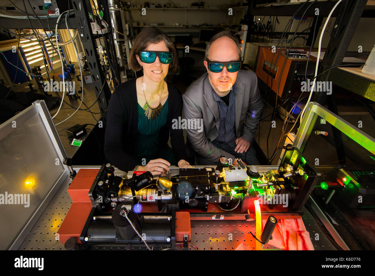 Canberra, Canberra. 6th Sep, 2017. Doctor Rose Ahlefeldt (L) and Associate Professor Matthew Sellars try to operate a high resolution dye laser, which they use to study rare earth crystals in the Australian National University (ANU), Canberra, on Sept. 6, 2017. Australian scientists have made a significant breakthrough in developing an 'unhackable' quantum internet, it was announced on Sept. 12. Credit: ANU/Stuart Hay/Xinhua/Alamy Live News Stock Photo