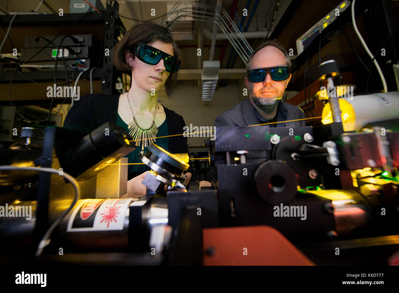 Canberra, Canberra. 6th Sep, 2017. Doctor Rose Ahlefeldt (L) and Associate Professor Matthew Sellars operate a high resolution dye laser, which they use to study rare earth crystals in the Australian National University (ANU), Canberra, on Sept. 6, 2017. Australian scientists have made a significant breakthrough in developing an 'unhackable' quantum internet, it was announced on Sept. 12. Credit: ANU/Stuart Hay/Xinhua/Alamy Live News Stock Photo