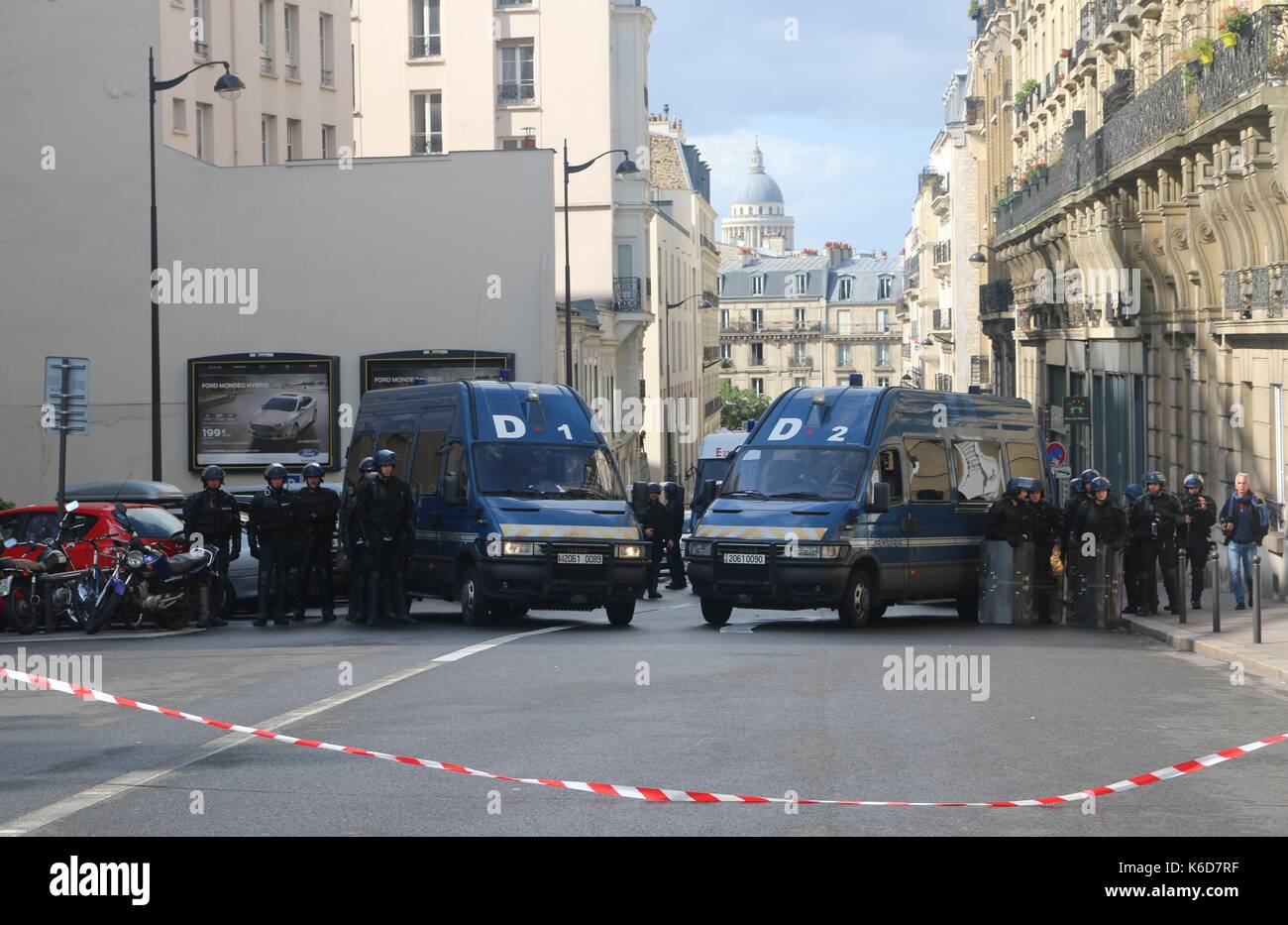 Police stand guard as Loi Travail march passes by in Paris Stock Photo
