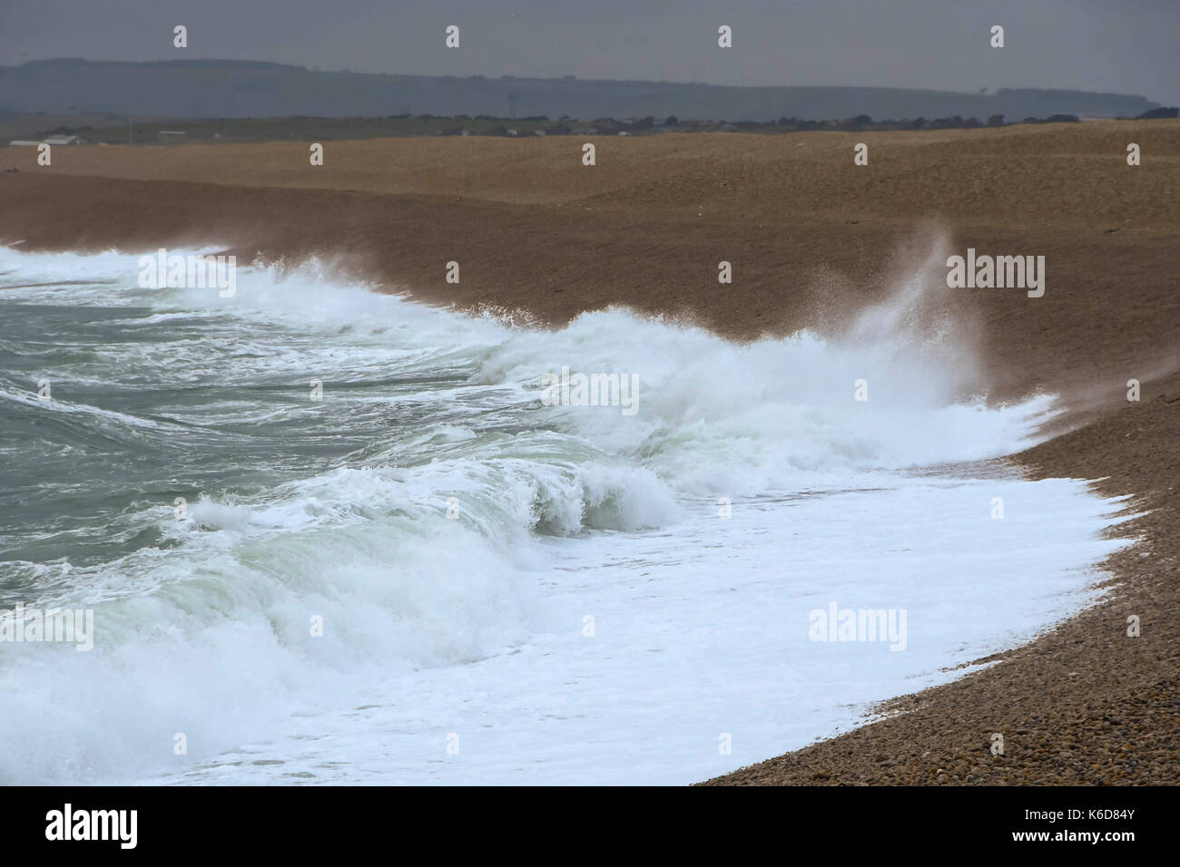Portland, Dorset, UK. 12th Sep, 2017. UK Weather. Rough seas crash ashore at Chesil Cove at Chiswell on the Isle of Portland in Dorset as strong winds build ahead of a stormy night with predicted gusts over 50mph. Photo Credit: Graham Hunt/Alamy Live News Stock Photo
