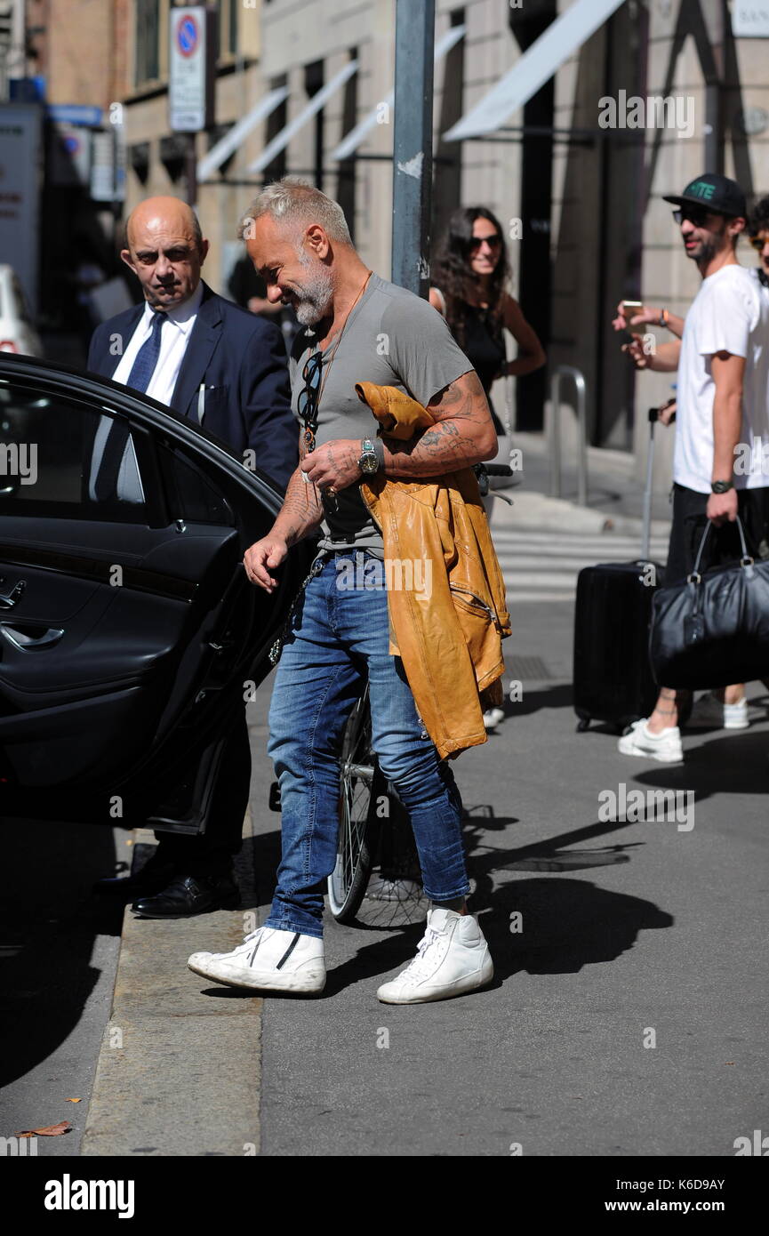 Milan, Gianluca Vacchi in the center with a rental car Gianluca Vacchi  surprised at lunchtime while doing some selfie with kids then climbs on a  car, not one of her but a