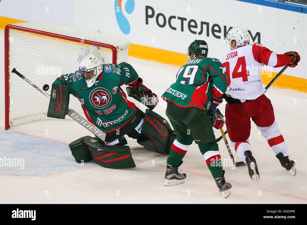 Kazan, Russia. 12th Sep, 2017. Ak Bars Kazan's goaltender Timur Bilyalov, Andrei Markov defend against Spartak Moscow's Ryan Stoa (L-R) in their 2017/18 KHL Regular Season ice hockey match at Tatneft Arena. HC Spartak Moscow won the game 4-3 in extra time. Credit: Yegor Aleyev/TASS/Alamy Live News Stock Photo