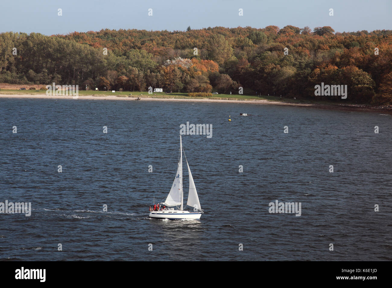 A small yacht sailing in Kiel harbour, northern Germany Stock Photo