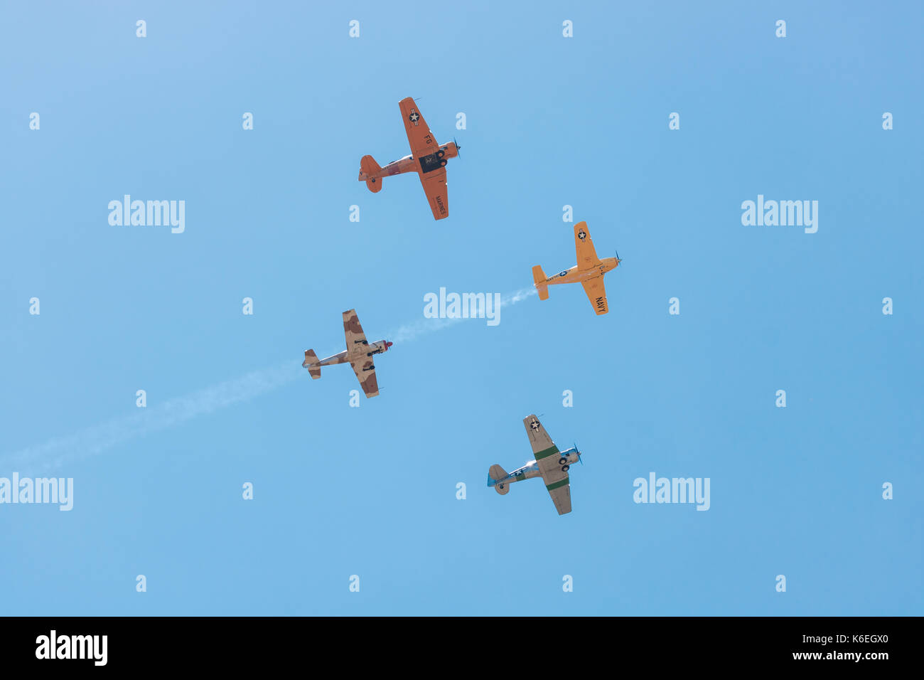 4 World War II Biplanes Flyover In Formation With Vapor Trails In Vivid 
