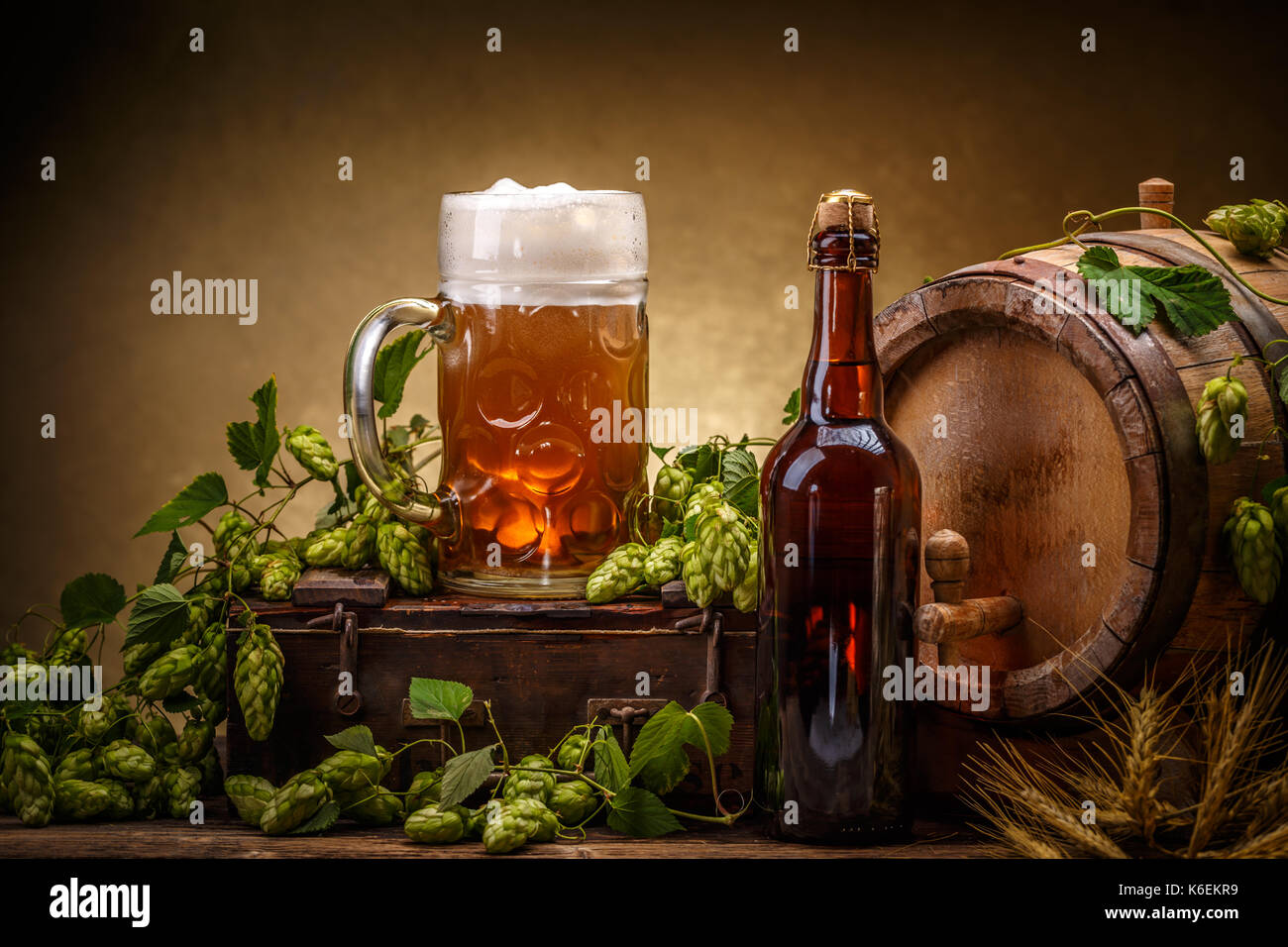 Still life with a keg of beer, decorated with hops Stock Photo Alamy