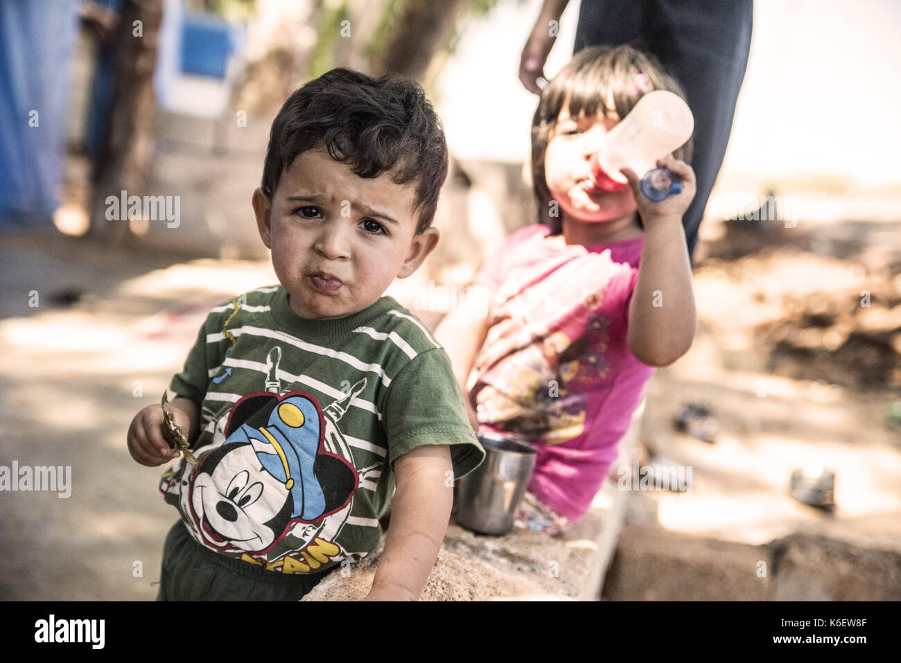 Syrian people in unofficial refugee camp in Reyhanli. These people are refugees from Idlib and escaped because of Syrian civil war. September 9, 2017, Stock Photo