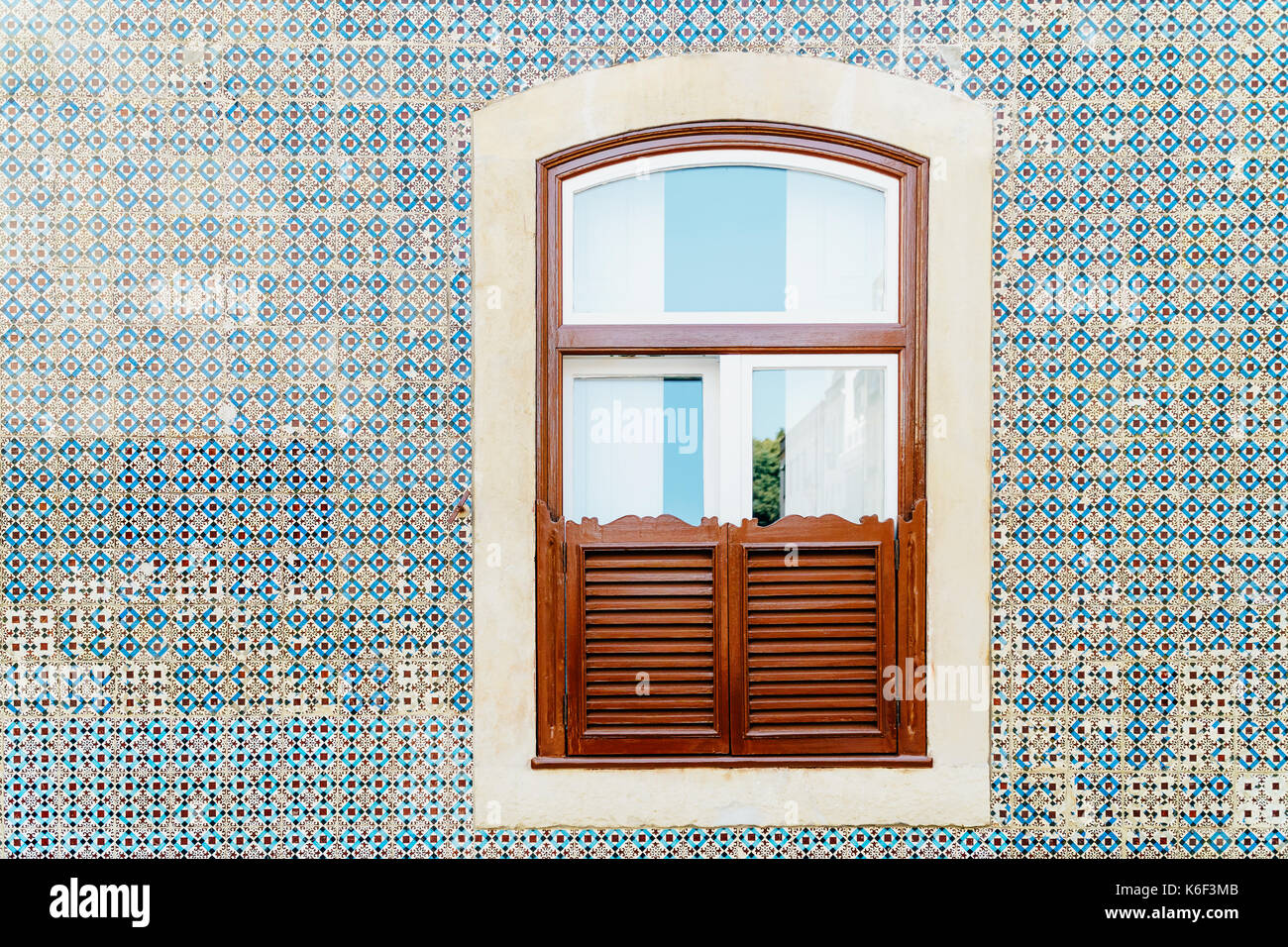 Vintage Wooden Window On Blue Tile Wall In Lisbon, Portugal Stock Photo