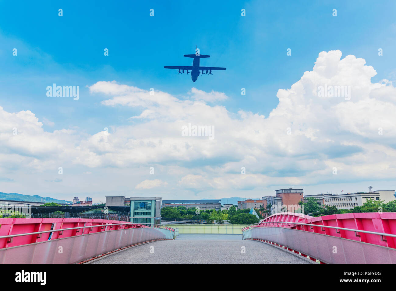TAIPEI, TAIWAN - JULY 03: This is a typical view of a plane flying over Taipei expo park into Songshan airport on July 03, 2017 in Taipei Stock Photo