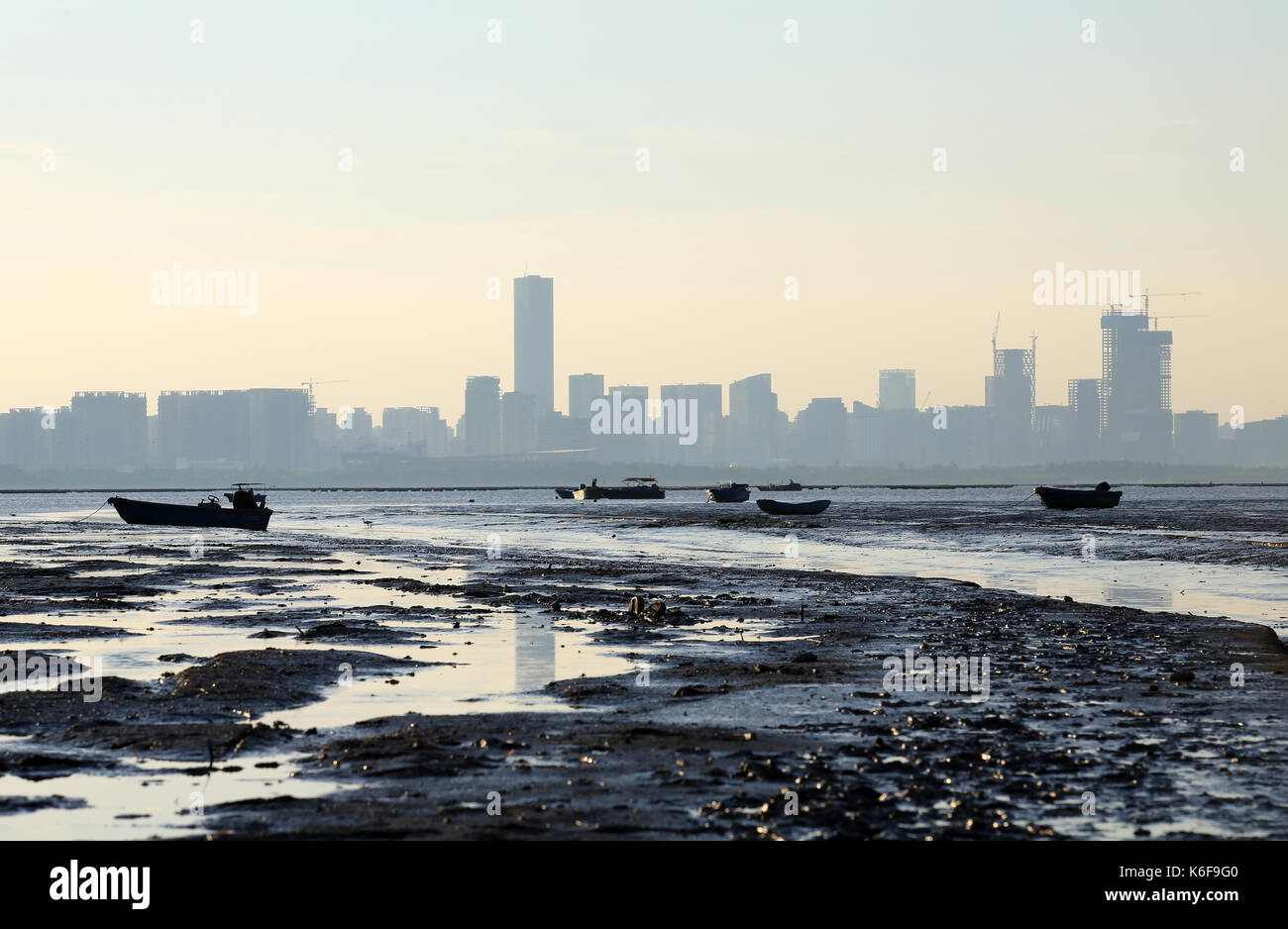 shenzhen city skyline with the tidal wave beach, scenes from hong kong to shenzhen coast at Ha Pak Nai, Yuen Long Stock Photo