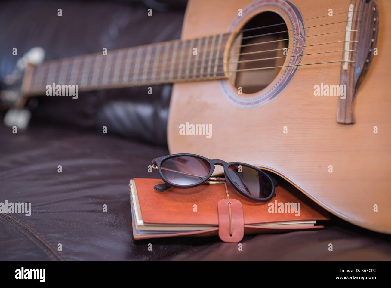 Travel journal with acoustic guitar Stock Photo