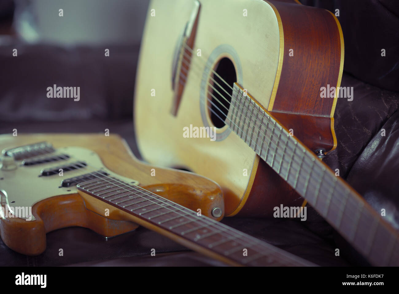Acoustic vs electric guitars Stock Photo Alamy