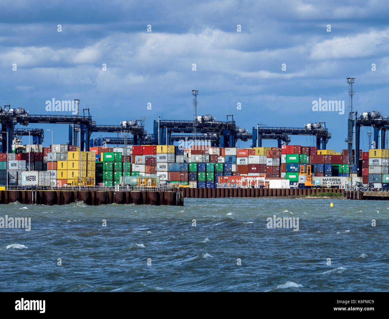 International Trade - containers being loaded and unloaded onto container ships at Felixstowe, the UK's main container port for imports and exports Stock Photo