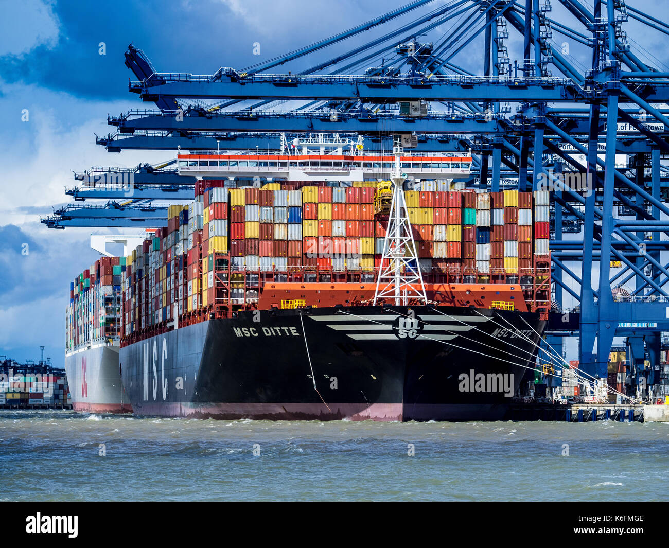 Global Supply Chains -International Trade Container Ship being loaded and unloaded at Felixstowe, the UK's main container port for imports and exports Stock Photo