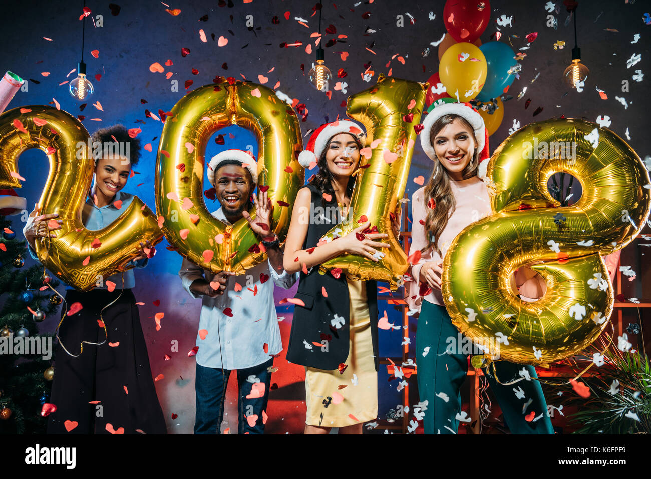 young friends with golden balloons Stock Photo - Alamy