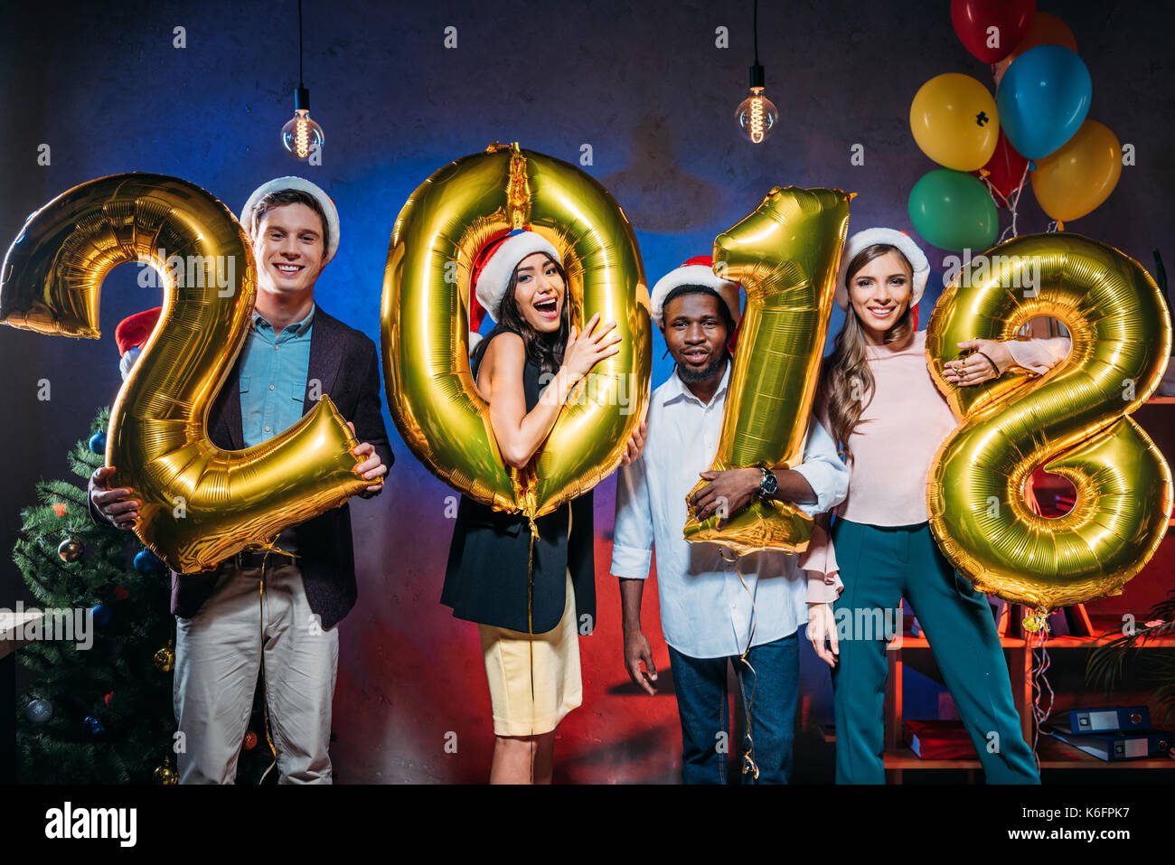 young friends with golden balloons Stock Photo - Alamy